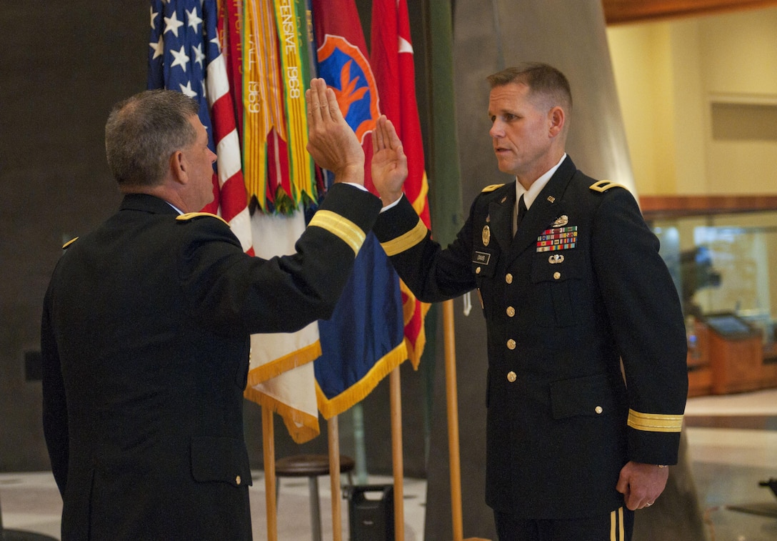 Maj. Gen. Mark T. McQueen, commander of the 108th Training Command (Initial Entry Training), administers the Oath of Office to Brig. Gen. Miles A. Davis during a promotion ceremony on September 11, 2016 at the National Infantry Museum at Fort Benning. Shortly after the promotion ceremony, Brig. Gen. Davis assumed command of the 98th Training Division (IET) on the parade field of the museum. Davis, an Army Reserve officer, is a resident of Livonia, Michigan.