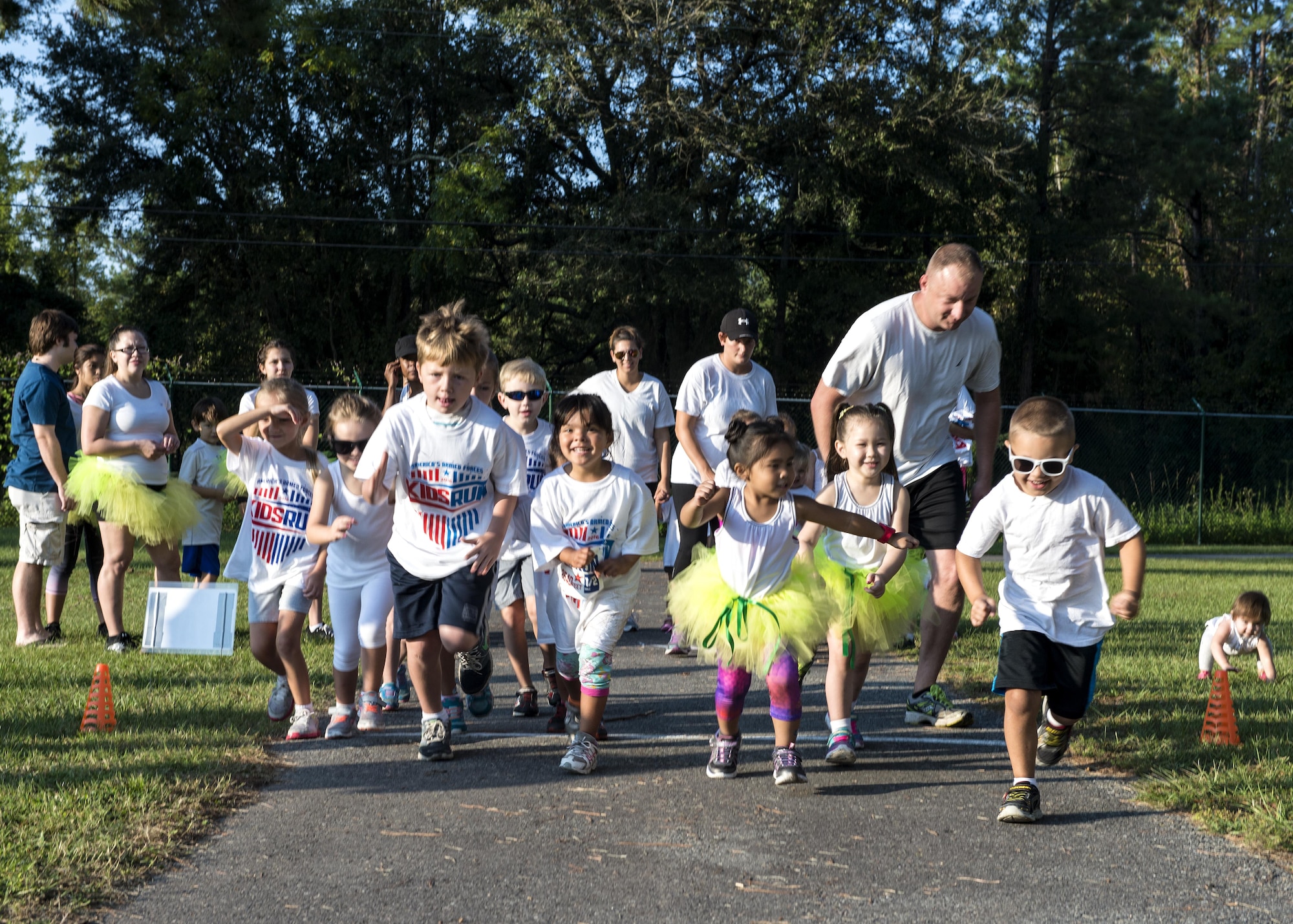 The first wave of children start the half-mile portion of the Kid’s Color Run, Sept. 10, 2016, at Moody Air Force Base, Ga. Children ages five to six competed in the .5 mile race, while ages seven to eight ran one mile, ages 9 to 13 ran two miles and 14 and older ran a 5k. (U.S. Air Force photo by Airman 1st Class Janiqua P. Robinson)