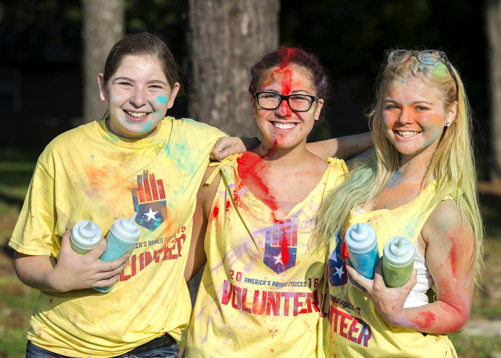 Volunteers pose for a photo during a Kid’s Color Run, Sept. 10, 2016, at Moody Air Force Base, Ga. Volunteers from Moody Youth Programs splashed participants with colorful scented chalk. (U.S. Air Force photo by Airman 1st Class Janiqua P. Robinson)