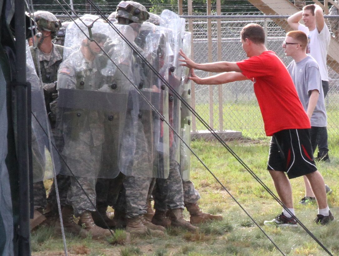 FORT MCCOY, Wis. - U.S. Army Reserve Soldiers with units in Illinois and Wisconsin roleplaying detainees incite a mock riot to test the reaction of U.S. Army Reserve Soldiers with the 603rd Military Police Company Aug. 20 during Combat Support Training Exercise 86-16-03 at Fort McCoy, Wis. (U.S. Army Reserve photo by Staff Sgt. Debralee Best)