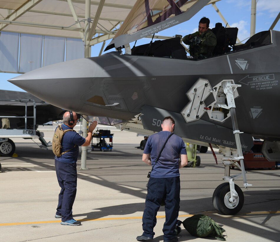 Maintainers look over the F-35 Lightning II at Luke Air Force Base, Ariz., Sept. 12, 2016. This sortie marks the 10,000th hour for the F-35 at Luke. (U.S. Air Force photo by Senior Airman James Hensley)
