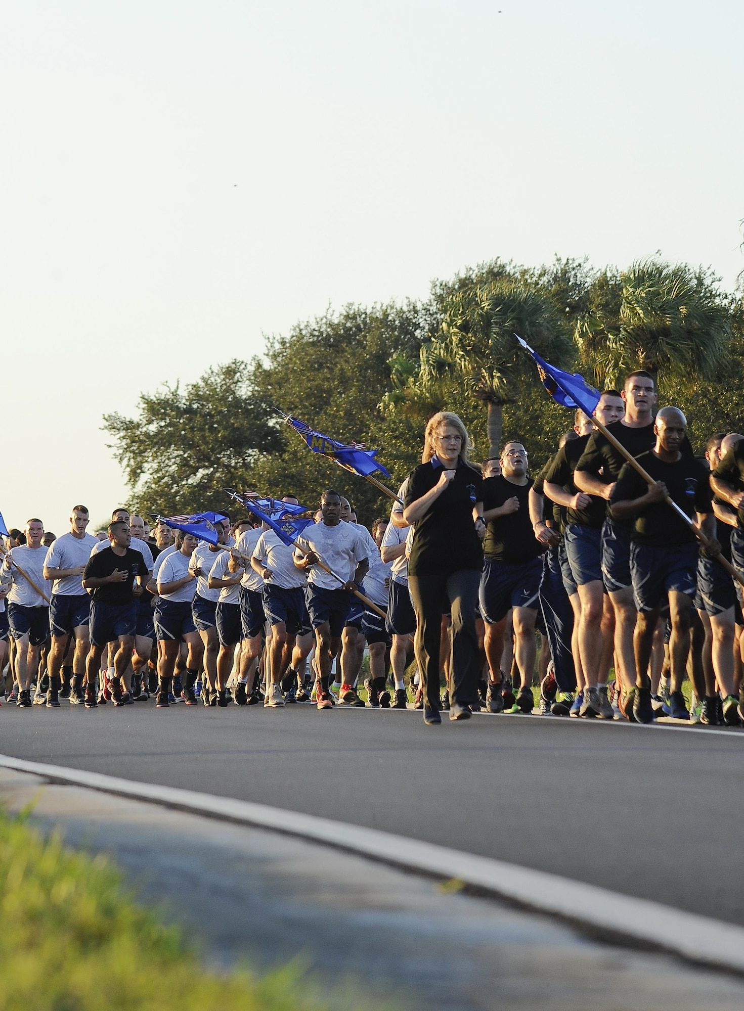 Members of Team MacDill run in formation during the 6th Annual Helton Haul Memorial Run at MacDill Air Force Base, Fla., Sept. 8, 2016. The annual run is held in memory of 1st Lt. Joseph D. Helton, a security forces officer assigned to the 6th Security Forces Squadron, who was killed in during his deployment to Iraq in 2009. (U.S. Air Force photo by Airman 1st Class Mariette Adams)