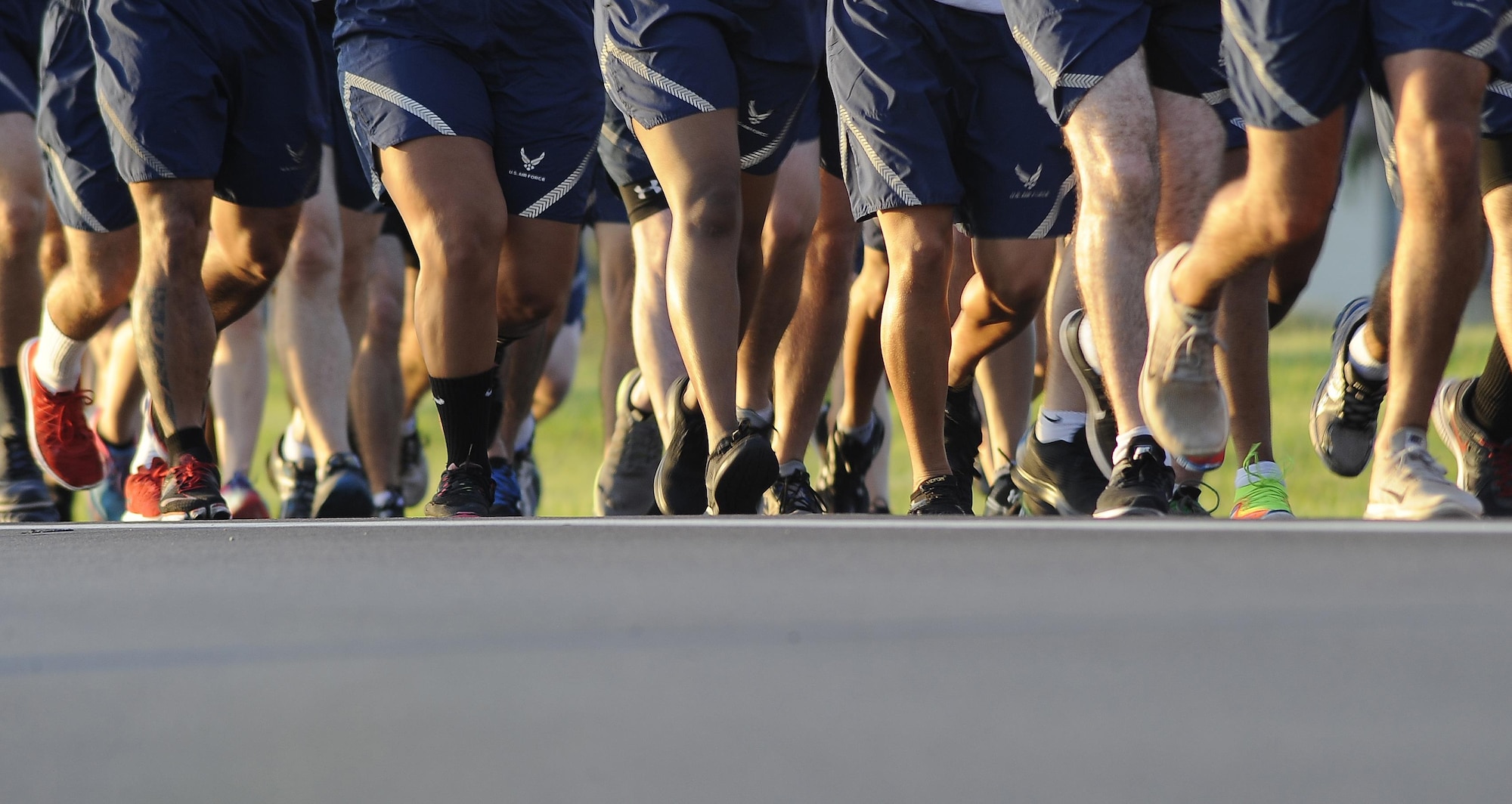 Members of Team MacDill run in formation at the 6th Annual Helton Haul Memorial Run at MacDill Air Force Base, Fla., Sept. 8, 2016. Every year since the death of 1st Lt. Joseph D. Helton, a fallen Airman, MacDill has held the Helton Haul Memorial Run in remembrance of his sacrifice. (U.S. Air Force photo by Airman 1st Class Mariette Adams)