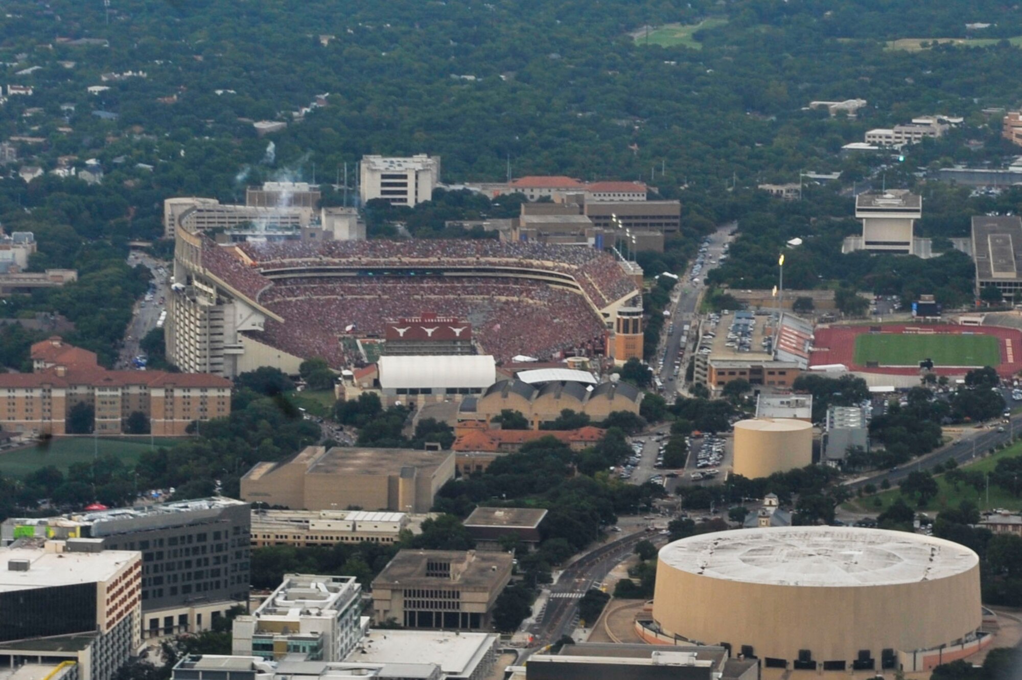 The view from inside a C-130J assigned to the 61st Airlift Squadron as it flies over the University of Texas at Austin versus the University of Notre Dame game, demonstrating the role of combat airlift in our nation's defense. (U.S. Air Force photo by Senior Airman Stephanie Serrano)