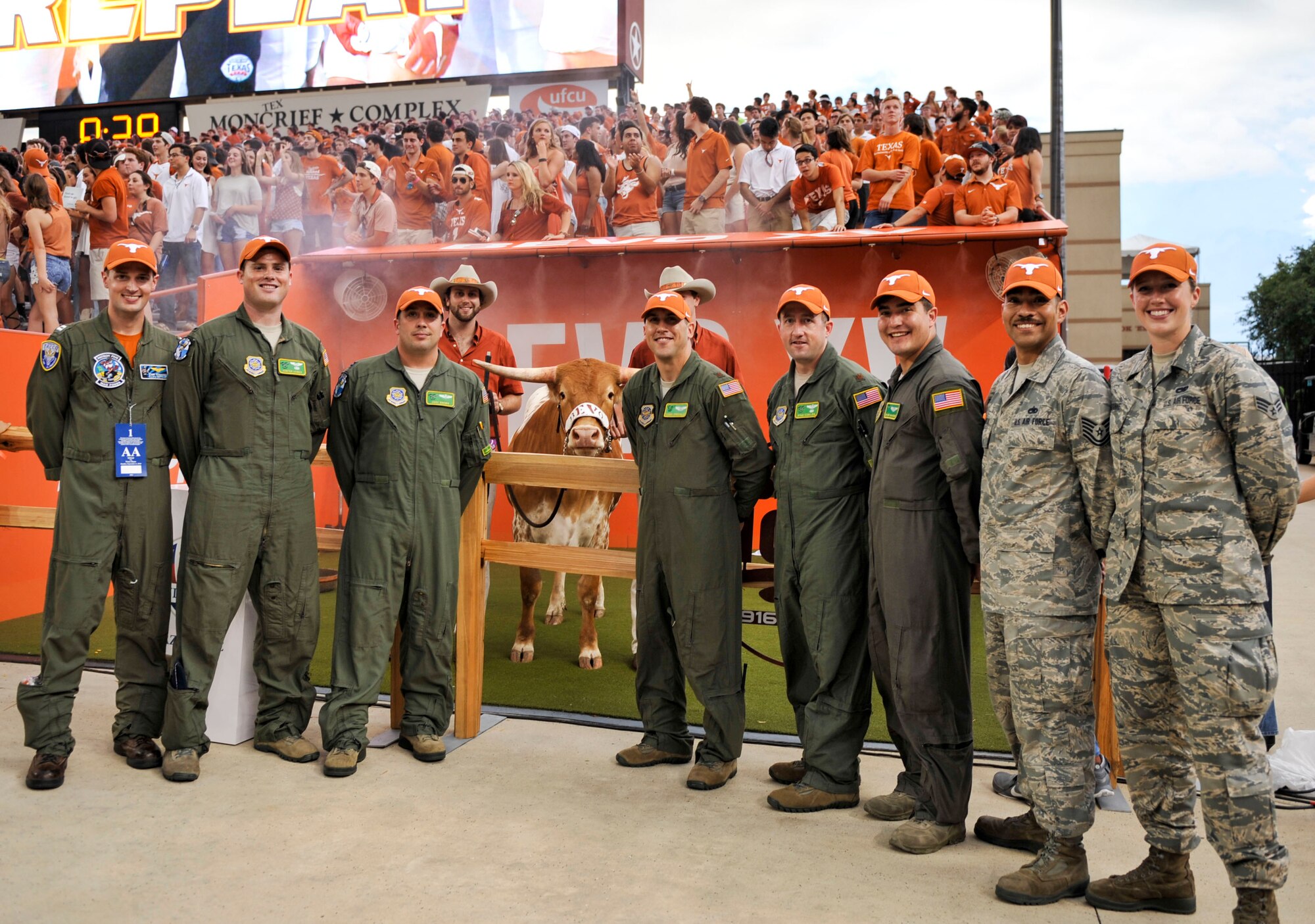 The Austin community recognizes the contributions of Combat Airlifters, assigned to the 61st Airlift Squadron, during the third quarter at the University of Texas, Austin and the University of Notre Dame game. (U. S. Air Force photo by Senior Airman Stephanie Serrano)