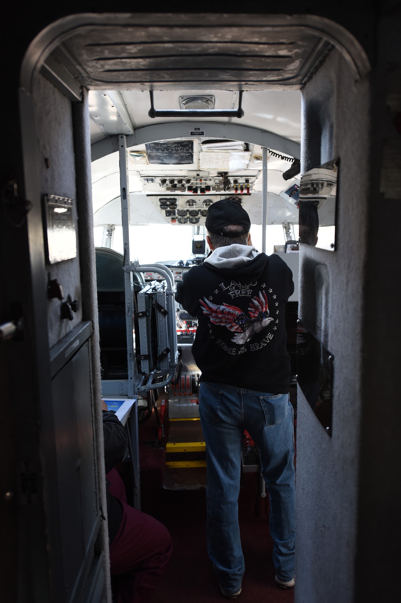A patron takes photos in the cockpit of a C-54E Skymaster named “Spirit of Freedom” at the Great Falls International Airport, Sept. 9, 2016. The Spirit of Freedom is a flying museum being flown all over the country by members of the Berlin Airlift Historical Foundation to help raise awareness of the Berlin Airlift. The airlift was a mission that saved nearly 2.4 million Germans from the Soviet-controlled East Berlin in the late 1940s and this is one of the only flight-worthy C-54s remaining in the world. (U.S. Air Force photo/Tech. Sgt. Chad Thompson)
