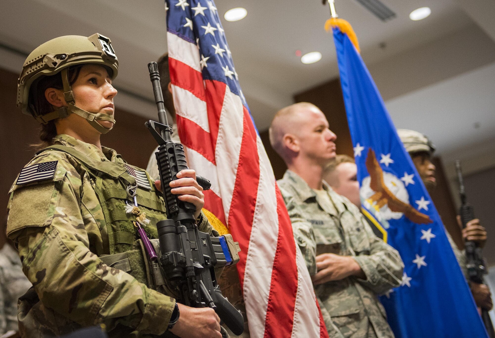 A color guard of 919th Special Operations Wing security forces and firefighters prepare to present the flag during the National Anthem at the 9/11 Memorial Ceremony Sept. 11 at Duke Field, Fla.  During the ceremony, Airmen took time to remember the tragic events and pay their respects to those who lost their lives.   (U.S. Air Force photo/Tech. Sgt. Sam King) 