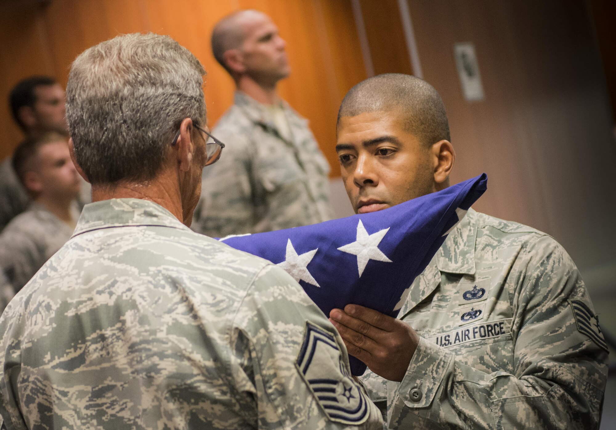 Airmen complete a flag-folding service at the 9/11 Memorial Ceremony Sept. 11 at Duke Field, Fla.  During the ceremony, Airmen took time to remember the tragic events and pay their respects to those who lost their lives.   (U.S. Air Force photo/Tech. Sgt. Sam King)