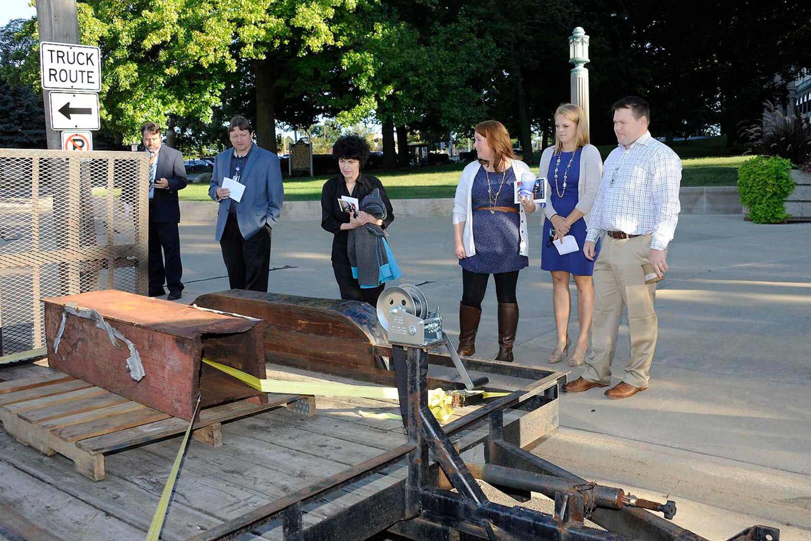 Defense Logistics Agency employees view a piece of the steel beams salvaged from the debris of the World Trade Center on display at the Patriot Day event.