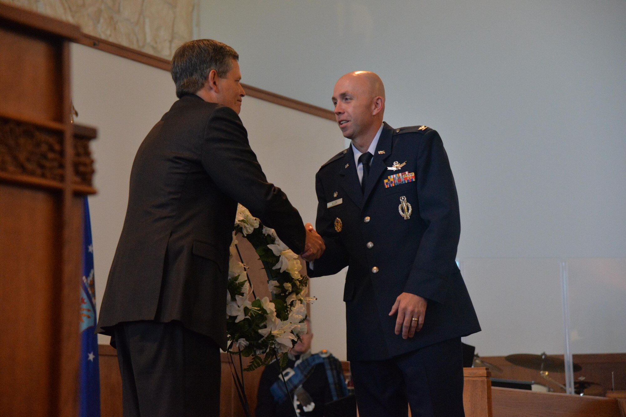 Col. Ron Allen, 341st Missile Wing commander, right, shakes hands with Montana Sen. Steve Daines, after the laying of the wreath during the 9/11 Remembrance ceremony Sept. 9, 2016, at Malmstrom Air Force Base, Mont. The wreath symbolizes beauty and brevity of life and memories of those who lost their lives 15 years ago and those who fight to keep the country safe and secure. (U.S. Air Force photo/Airman 1st Class Daniel Brosam)
