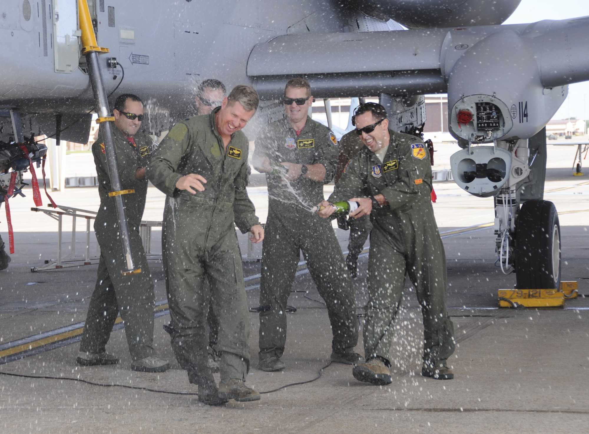Members of the 303rd Fighter Squadron soak their fellow member and A-10 pilot, Col. Stephen Nester, after his final flight with the squadron on Sept. 10, 2016, at Whiteman Air Force Base, Mo. Nester arrived at the 303rd FS, a component of the 442nd Fighter Wing, in August 1994 from the 45th FS at Grissom Air Reserve Base, Indiana. (U.S. Air Force photo/Senior Airman Missy Sterling) 