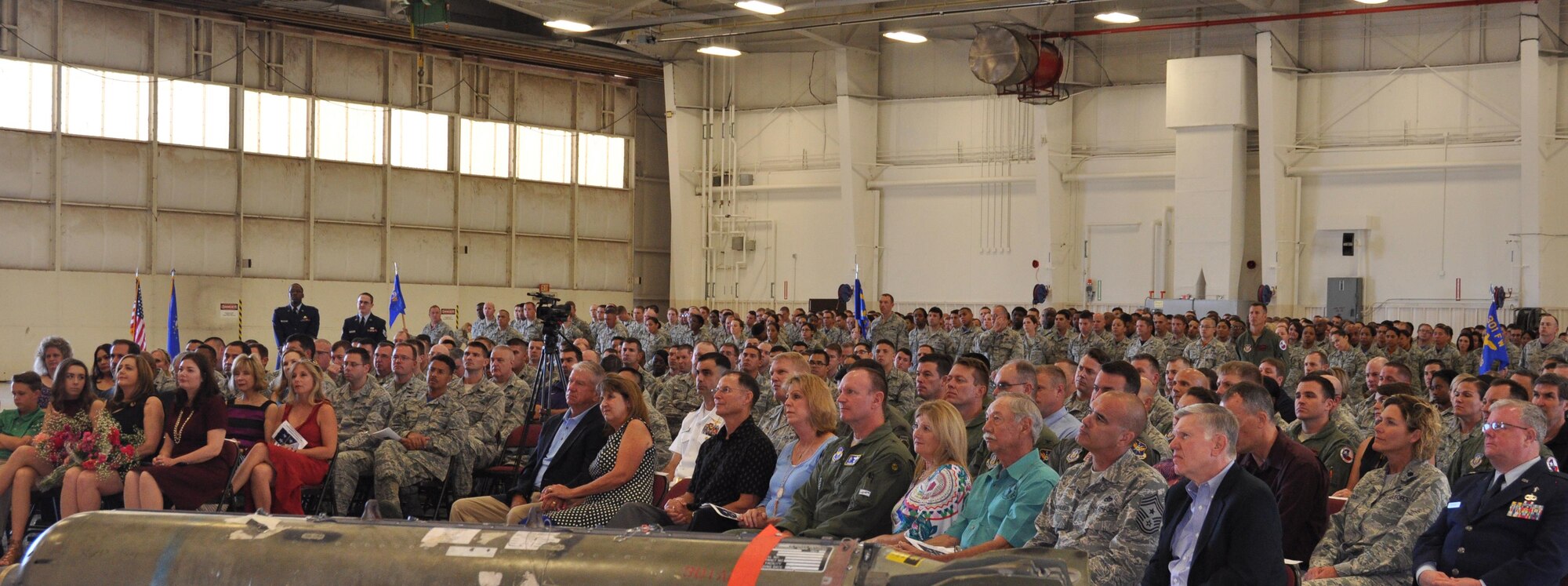 Civilians and military members attend the 301st Fighter Wing change of command ceremony at the hangar Sept. 11 at Naval Air Station Fort Worth Joint Reserve Base, Texas. During the ceremony, Col. John M. Breazeale relinquished command of the wing to Col. Gregory C. Jones. Maj. Gen. Richard W. Scobee, 10th Air Force commander, presided over the ceremony. (U.S. Air Force photo by Staff Sgt. Melissa Harvey)