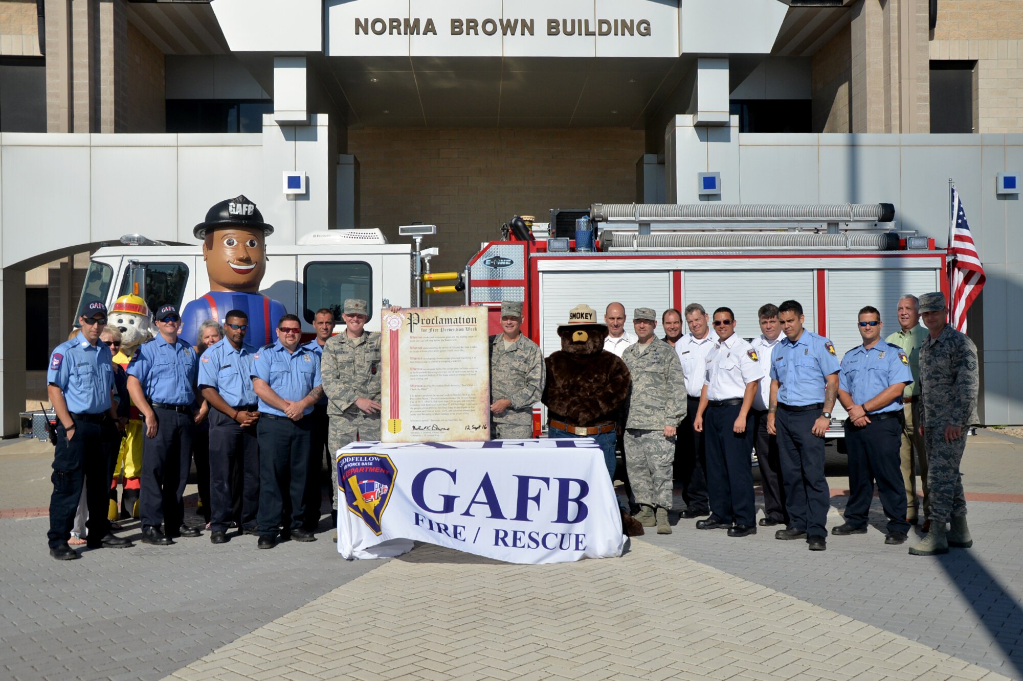 U.S. Air Force Col. Michael Downs, 17th Training Wing Commander, and Goodfellow Fire Department members stand with the Fire Prevention Week Proclamation at the Norma Brown building on Goodfellow Air Force Base, Texas, Sept. 12, 2016. The Fire Prevention Week’s theme is ‘Don’t wait, check the date,’ reminding Team Goodfellow to check the expiration dates on their smoke detectors and fire extinguishers. (U.S. Air Force photo by Airman 1st Class Randall Moose/Released)
