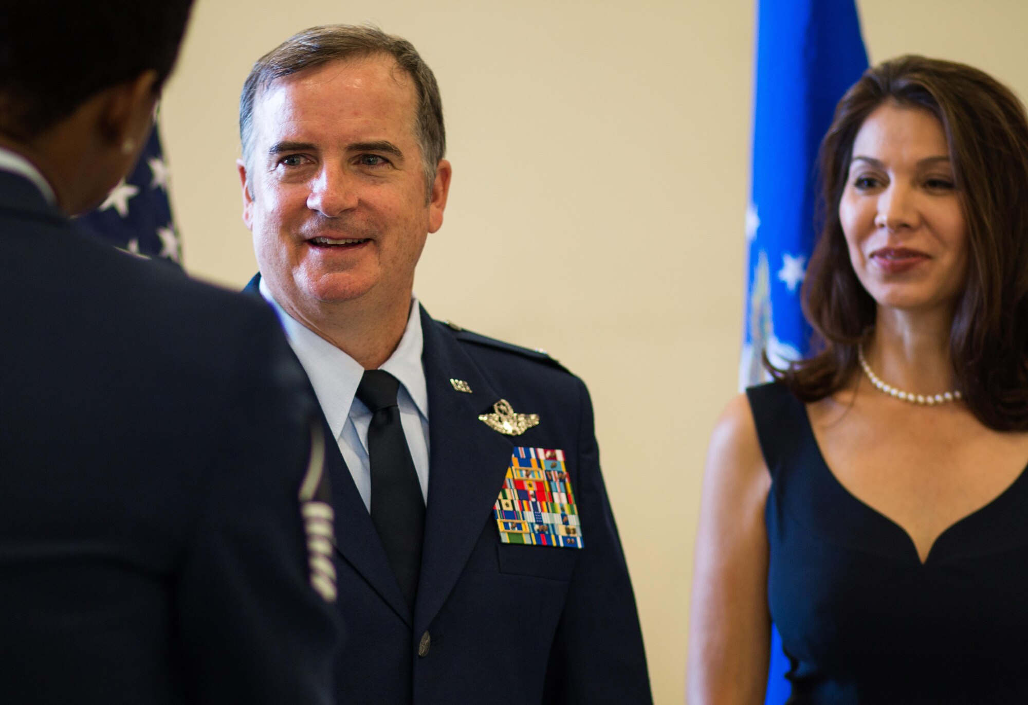 301st Fighter Wing Commander, Col. Gregory C. Jones and his wife, Helen Cass, meet wing Airmen after the change of command ceremony in the hangar Sept. 9 at Naval Air Station Fort Worth Joint Reserve Base, Texas. Jones joins the wing from 10th Air Force where he was the director of operations and plans. He is a command pilot with more than 4,400 flying hours in various aircraft. (U.S. Air Force photo by Master Sgt. Josh Woods)