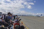 Attendees take photos of the Japan Air Self Defense Force aerobatic demonstration during Misawa Air Fest 2016 at Misawa Air Base, Japan, Sept. 11, 2016. Approximately 80,000 people attended the event and experienced static displays and demonstrations from both the JASDF and American forces.