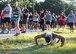 A participant drops to the ground for a set of push-ups before the start of the 9/11 Memorial Run Sept. 9 at the All Wars Memorial at Eglin Air Force Base, Fla. Approximately 250 runners and walkers participated in the run to honor and remember the fallen of the 9/11 terror attacks committed 15 years ago. (U.S. Air Force photo/Ilka Cole)