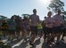 Runners race past the start line during the 9/11 Memorial Run Sept. 9 at the All Wars Memorial at Eglin Air Force Base, Fla. Approximately 250 runners and walkers participated in the run to honor and remember the fallen of the 9/11 terror attacks committed 15 years ago. (U.S. Air Force photo/Ilka Cole)