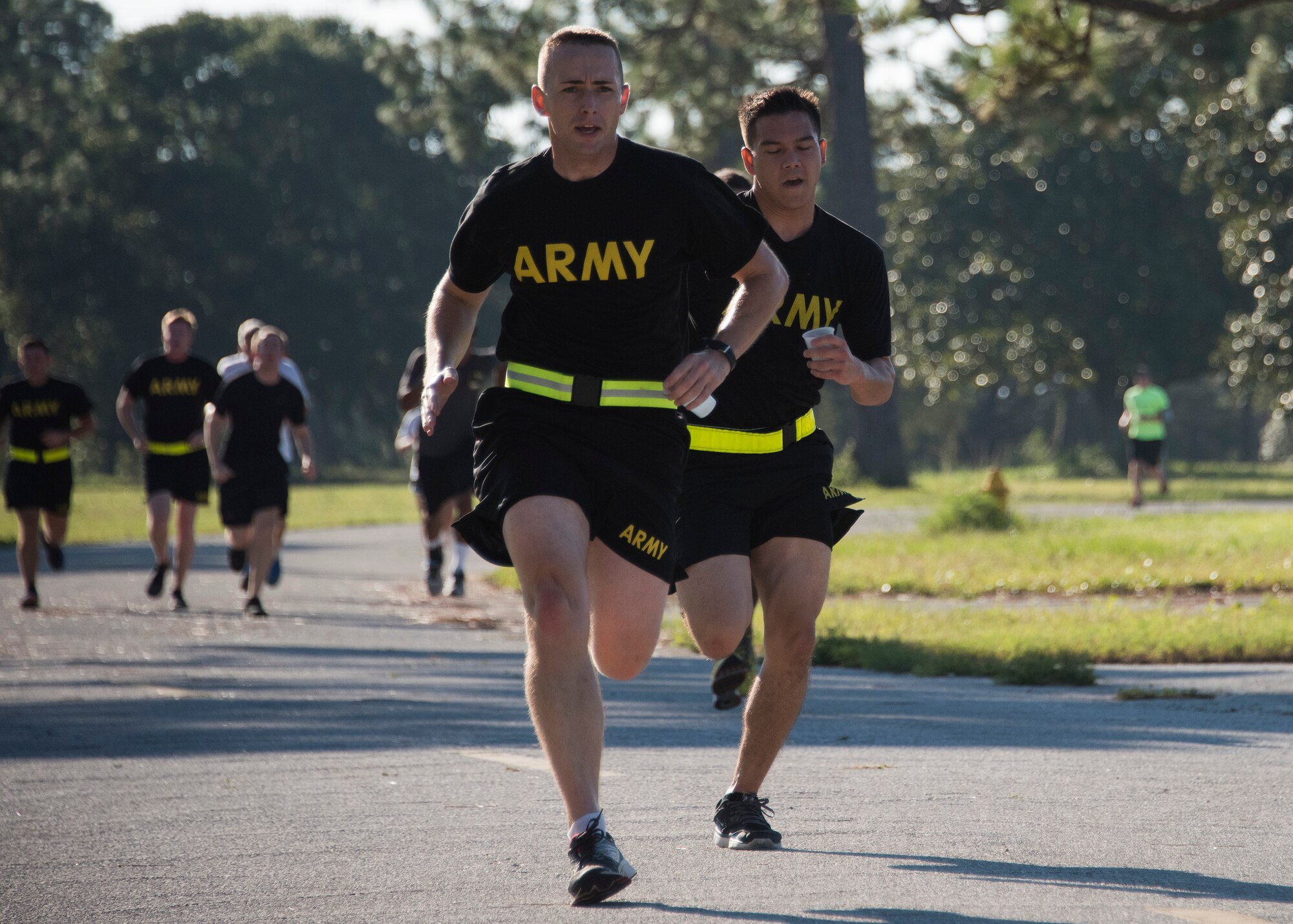 An explosive ordnance disposal Soldier races toward the finish line during the 9/11 Memorial Run Sept. 9 at the All Wars Memorial at Eglin Air Force Base, Fla. Approximately 250 runners and walkers participated in the run to honor and remember the fallen of the 9/11 terror attacks committed 15 years ago. (U.S. Air Force photo/Ilka Cole)
