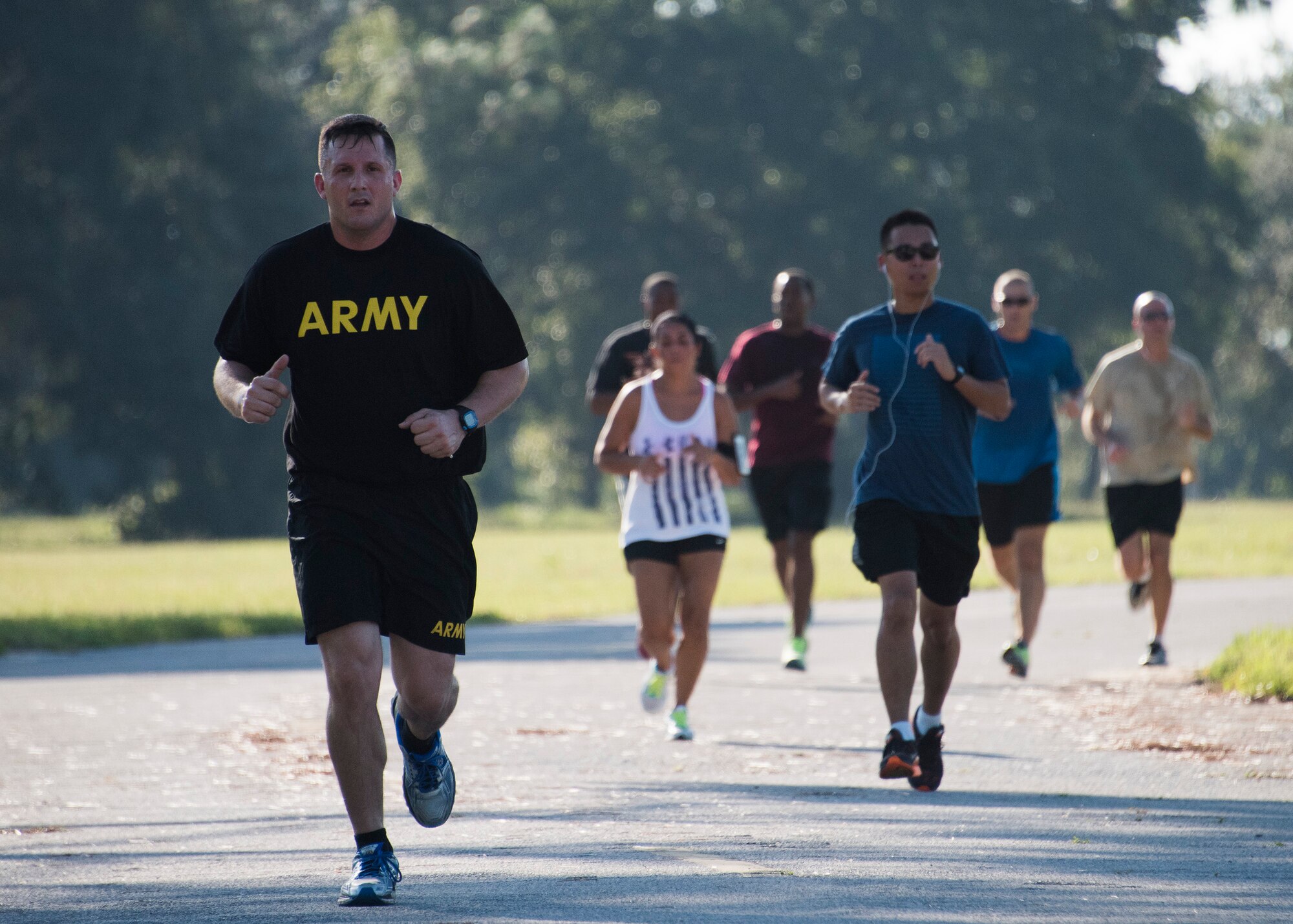 An explosive ordnance disposal Soldier runs toward the finish line during the 9/11 Memorial Run Sept. 9 at the All Wars Memorial at Eglin Air Force Base, Fla. Approximately 250 runners and walkers participated in the run to honor and remember the fallen of the 9/11 terror attacks committed 15 years ago. (U.S. Air Force photo/Ilka Cole)