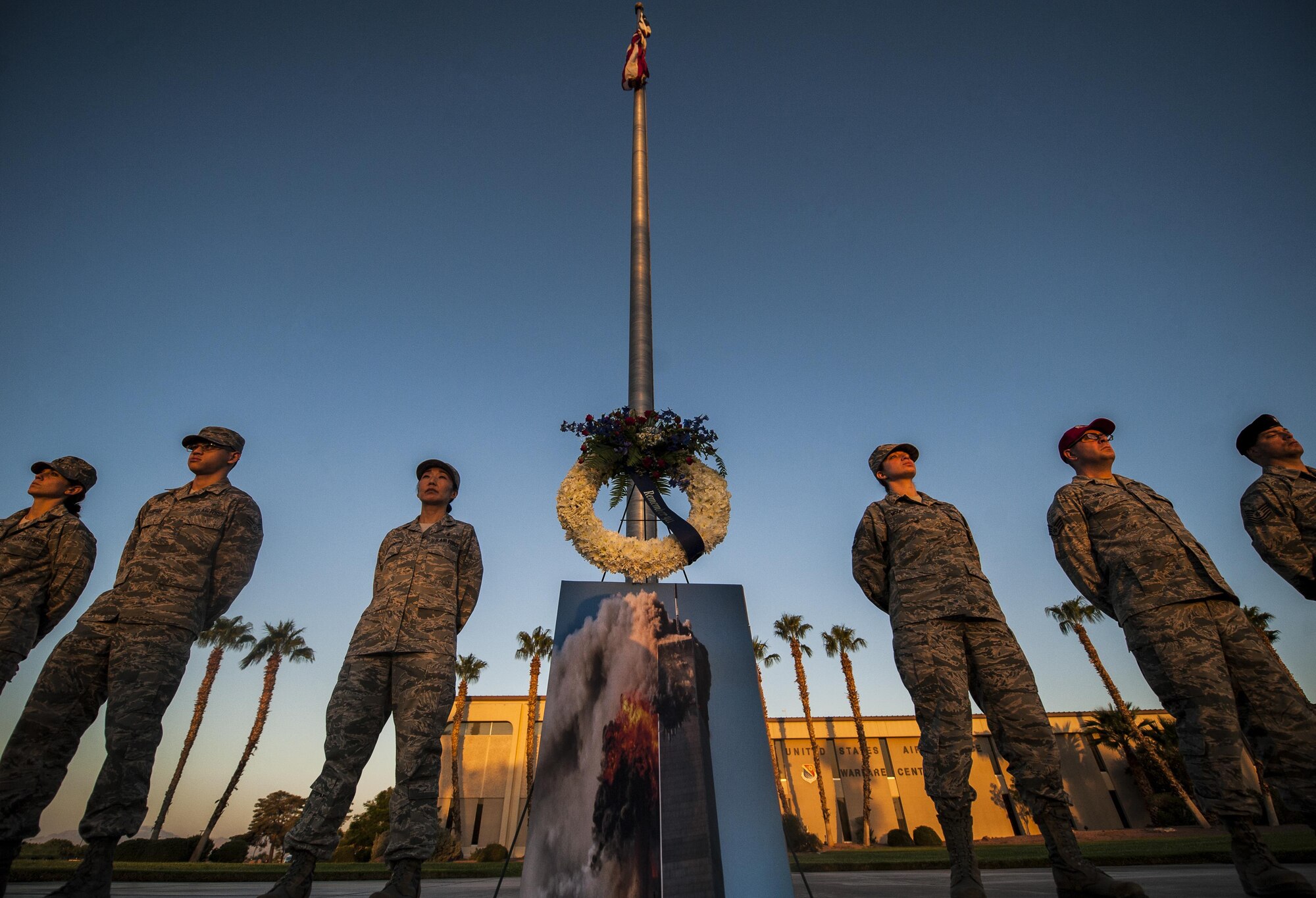 Airmen from Nellis Air Force Base stand at parade rest to honor the lives lost on Sept. 11 in front of the United States Air Force Warfare Center, Sept. 9, 2016. Airmen volunteered thirty minutes of their time to stand at parade rest in order to show their appreciation for the victims of 9/11. (U.S. Air Force photo by Airman 1st Class Kevin Tanenbaum/Released)
