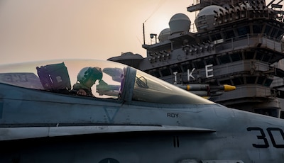 A Navy pilot assigned to Strike Fighter Squadron 131 taxies an F/A-18C Hornet on the flight deck of the aircraft carrier USS Dwight D. Eisenhower in the Persian Gulf, Sept. 9, 2016. The Eisenhower and its carrier strike group are deployed in support of Operation Inherent Resolve, maritime security operations and theater security cooperation efforts in the U.S. 5th Fleet area of operations. Navy photo by Petty Officer 3rd Class Nathan T. Beard