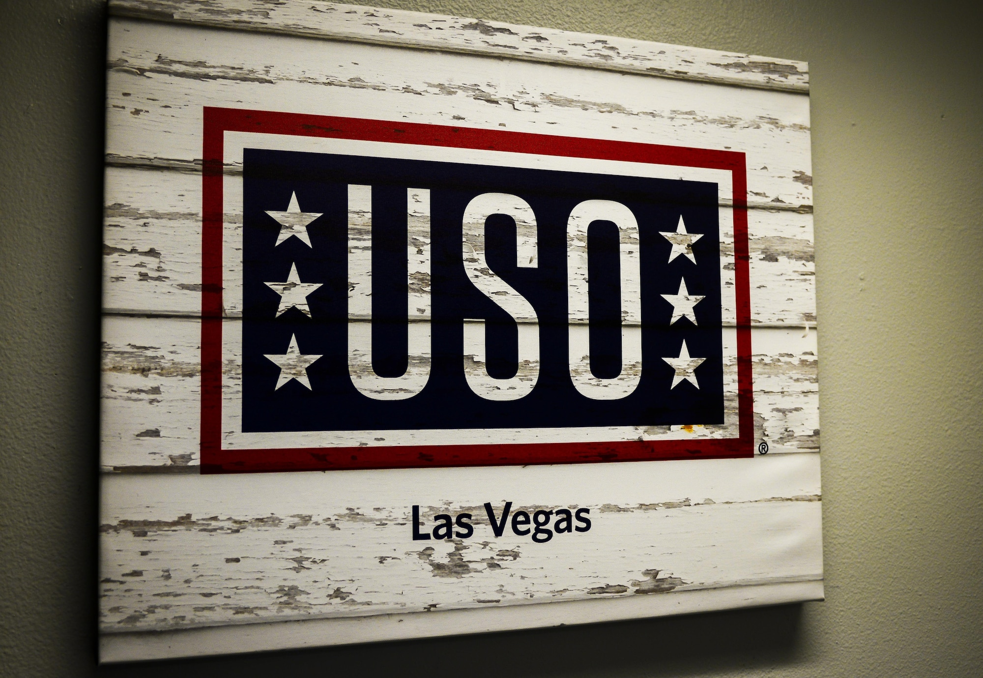 A sign hangs in front of the USO office located at the Community Commons Building at Nellis Air Force Base, Nev., Aug. 31, 2016. The USO Transition 360 Alliance is an initiative to help U.S. military personnel and their families successfully transition into civilian life after their service ends. (U.S. Air Force photo by Airman 1st Class Nathan Byrnes)