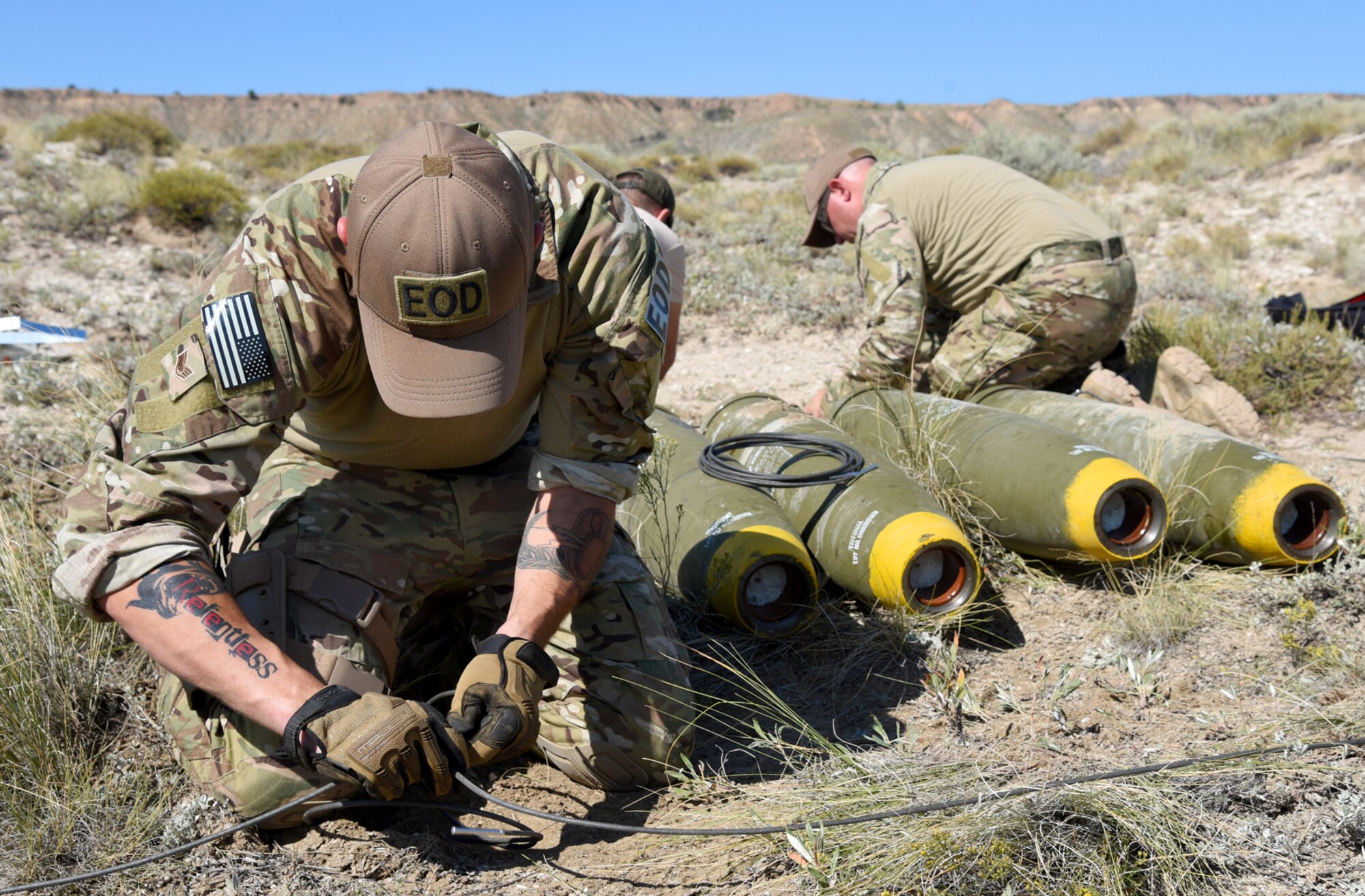 FORT CARSON, Colo. – Staff Sgt. Steven Fontana, 21st Civil Engineer Squadron Explosive Ordnance Disposal plans and intelligence NCO in charge, ties detonation cords to explosives at the bombing range at Fort Carson, Colo., Aug 31, 2016. This was the largest mass demolition exercise the 21st CES EOD flight has had training with to date. (U.S. Air Force photo by Airman 1st Class Dennis Hoffman)