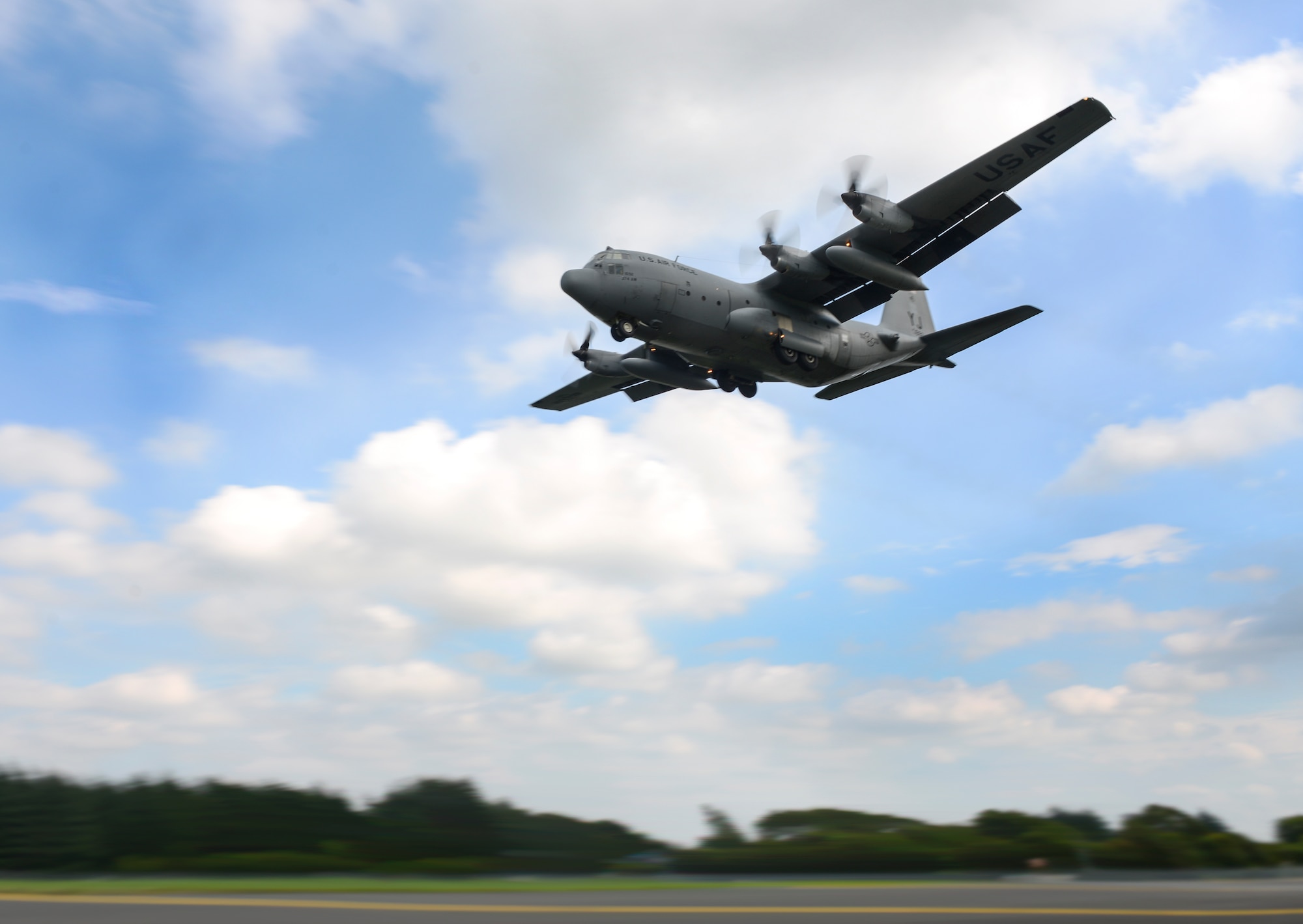 A C-130 Hercules assigned to the 36th Airlift Squadron comes in for a touch-and-go landing at Yokota Air Base, Japan, Sep. 7, 2016. Yokota C-130s perform touch-and-goes regularly, allowing aircrew to practice take-offs and landings, sharpening their flight skills. (U.S. Air Force Photo by Airman 1st Class Baker/Released)