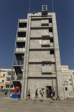 U.S. Marines, sailors and civilians joined together for a 9/11 Memorial Stair Climb at Marine Corps Air Station Iwakuni, Japan, Sept. 9, 2016. The stair climb honored the fallen firefighters who responded to the attacks on the World Trade Centers on Sept. 11, 2001. While conducting the climb, each participant carried a photo of the 343 fallen firefighters. (U.S. Marine Corps photo by Lance Cpl. Aaron Henson)