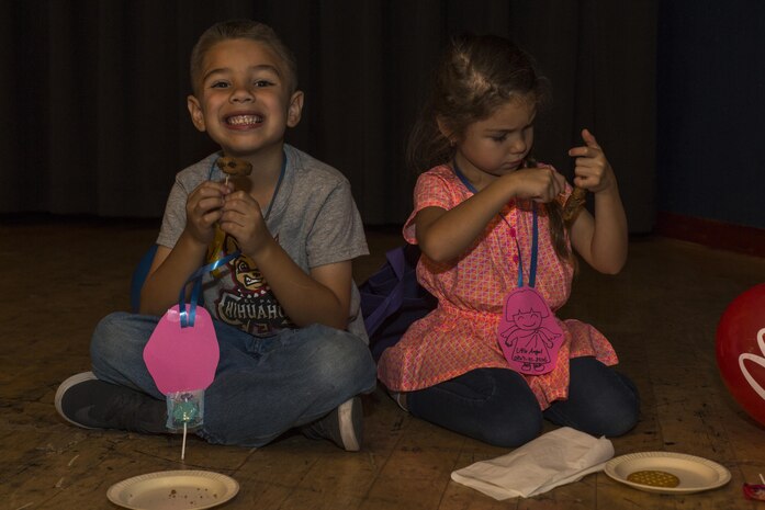 Christopher Smith Jr., left, and Bella Smith, event attendees, enjoy their food during the Iwakuni Expo at Marine Corps Air Station Iwakuni, Japan, Sept. 10, 2016. Throughout the expo, residents enjoyed shows by the Kishi Dancers, Semper Fit Group Exercise Program and Marifu Daiko-a drumming group. Residents also had the opportunity to win prizes such as gift cards, tickets, camping equipment or a weekend trip. (U.S. Marine Corps photo by Lance Cpl. Aaron Henson)