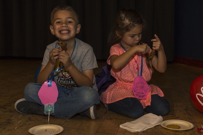 Christopher Smith Jr., left, and Bella Smith, event attendees, enjoy their food during the Iwakuni Expo at Marine Corps Air Station Iwakuni, Japan, Sept. 10, 2016. Throughout the expo, residents enjoyed shows by the Kishi Dancers, Semper Fit Group Exercise Program and Marifu Daiko-a drumming group. Residents also had the opportunity to win prizes such as gift cards, tickets, camping equipment or a weekend trip. (U.S. Marine Corps photo by Lance Cpl. Aaron Henson)