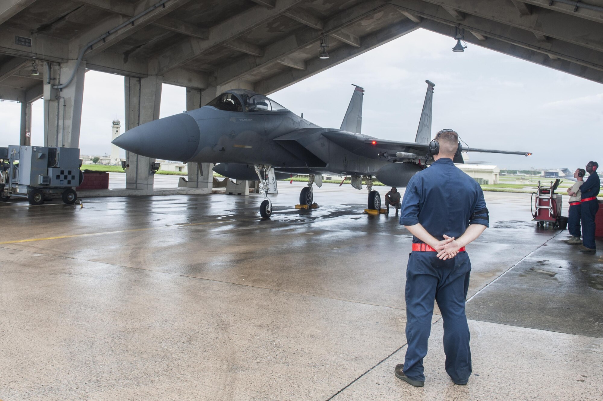 Airman 1st Class Dennis Hatcher, 18th Aircraft Maintenance Squadron crew chief, prepares to guide an F-15 Eagle Sept. 9, 2016, at Kadena Air Base, Japan. F-15 Eagles departed from Kadena in support of Exercise Valiant Shield. Valiant Shield is a joint exercise between the U.S. armed forces which focuses on maintaining land, air, sea and cyberspace dominance in the Pacific. (U.S. Air Force photo by Senior Airman Lynette M. Rolen)