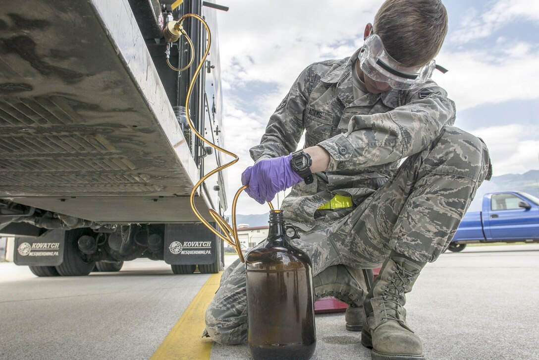 Airman 1st Class Chandler Adams tests a fuel sample at Aviano Air Base, Italy, Sept. 7, 2016. Airmen test fuel to ensure it is free of contaminants that could negatively affect the aircraft. Adams is a fuels laboratory technician assigned to the 31st Logistics Readiness Squadron. Air Force photo by Airman 1st Class Cory W. Bush


