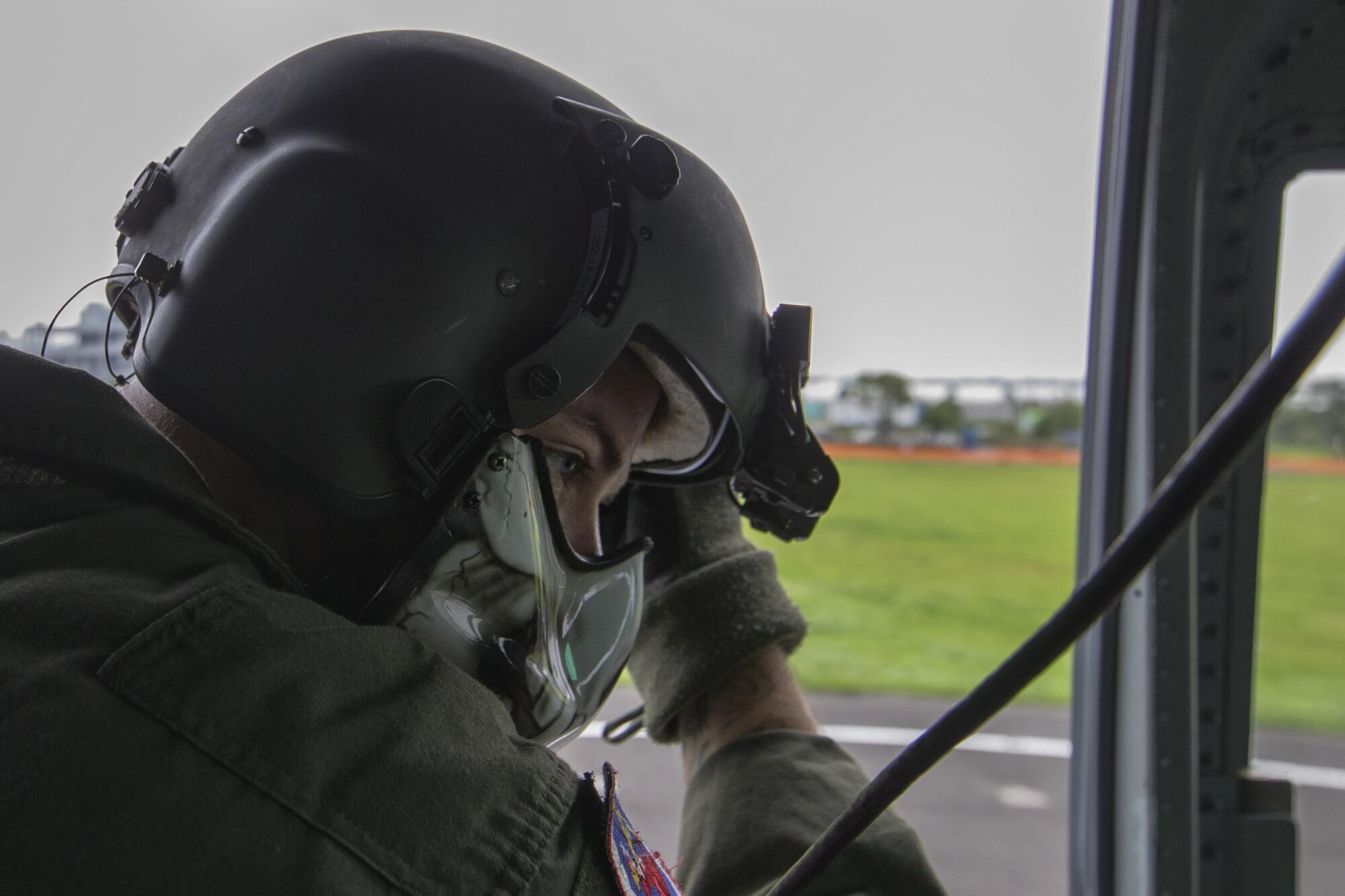 Tech. Sgt. Christopher Rector, 459th Airlift Squadron flight engineer, communicates with crewmembers before taking off at the Tokyo Rinkai Disaster Prevention Park, Japan, Sept. 4, 2016, during the Annual Tokyo Metropolitan Government Disaster Management Drill. Airmen with the 459 AS practiced delivering simulated relief supplies to Tokyo Rinkai Disaster Prevention Park in downtown Tokyo. The park is located in the Ariake area and is a disaster countermeasure headquarters of the Government of Japan and other local governments during large-scale earthquakes in the metropolitan area. (U.S. Air Force photo by Yasuo Osakabe/Released)    