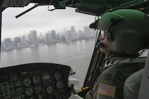 Capt. Vicente Vasquez, 459th Airlift Squadron UH-1N Iroquois pilot, flies over Tokyo Bay after delivering simulated relief supplies at Tokyo Rinkai Disaster Prevention Park, Japan, Sept. 4, 2016, during the Annual Tokyo Metropolitan Government Disaster Prevention Drill. Airmen with the 459 AS practiced delivering simulated relief supplies to Tokyo Rinkai Disaster Prevention Park in downtown Tokyo. The park is located in the Ariake area and is a disaster countermeasure headquarters of the Government of Japan and other local governments during large-scale earthquakes in the metropolitan area. (U.S. Air Force photo by Yasuo Osakabe/Released)    