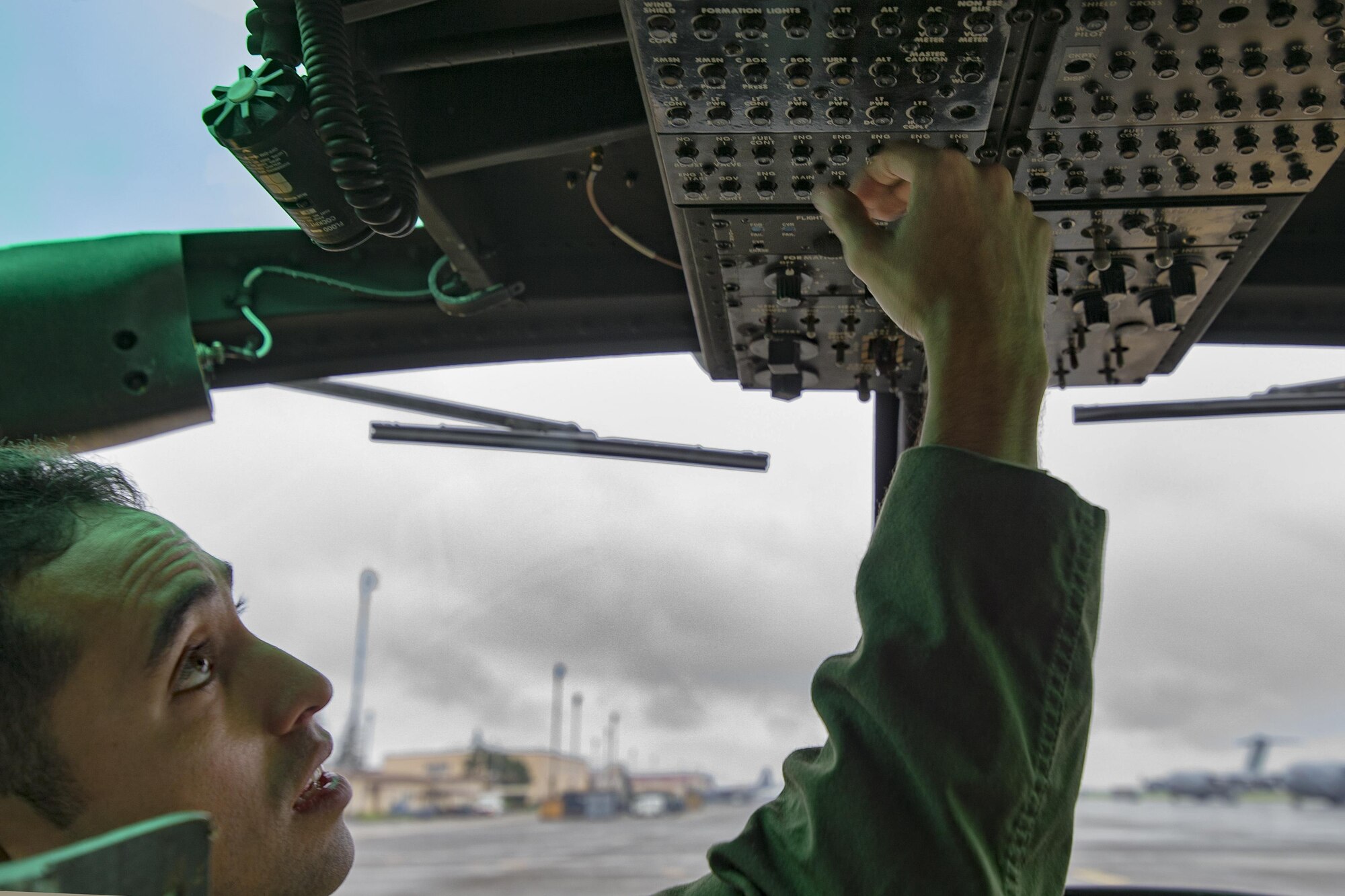Capt. Jonathan Bonilla, 459th Airlift Squadron UH-1N Iroquois pilot, performs a pre-flight inspection in a UH-1N at Yokota Air Base, Japan, Sept. 4, 2016, during the Tokyo Metropolitan Government Disaster Management Drill. Airmen with the 459 AS delivered simulated disaster relief supplies to the Tokyo Rinkai Disaster Prevention Park during the drill. The park is located in the Ariake area and is a disaster countermeasure headquarters of the Government of Japan and other local governments during large-scale earthquakes in the metropolitan area. (U.S. Air Force photo by Yasuo Osakabe/Released) 