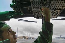 Capt. Jonathan Bonilla, 459th Airlift Squadron UH-1N Iroquois pilot, performs a pre-flight inspection in a UH-1N at Yokota Air Base, Japan, Sept. 4, 2016, during the Tokyo Metropolitan Government Disaster Management Drill. Airmen with the 459 AS delivered simulated disaster relief supplies to the Tokyo Rinkai Disaster Prevention Park during the drill. The park is located in the Ariake area and is a disaster countermeasure headquarters of the Government of Japan and other local governments during large-scale earthquakes in the metropolitan area. (U.S. Air Force photo by Yasuo Osakabe/Released) 