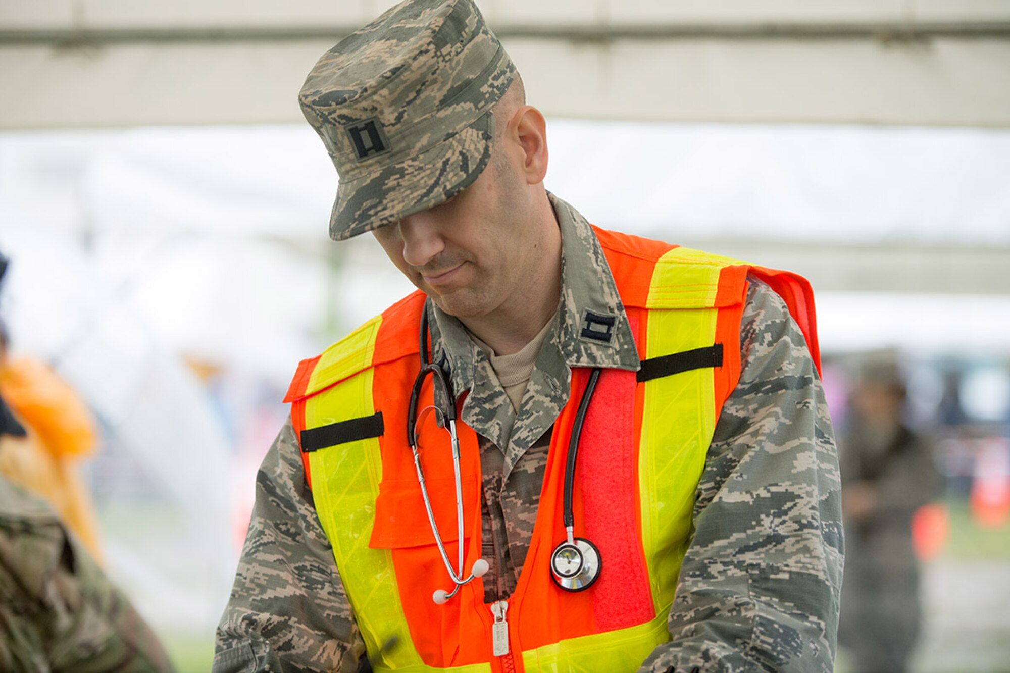 Capt. Robert Alexander, 374th Medical Group physician assistant, prepares to treat the injuries of a simulated patient during the Kanagawa Prefecture Government Joint Disaster Drill at Japan Ground Self-Defense Force Camp Takeyama, Japan, Sept. 11, 2016. Yokota Airmen have participated in the drill since 2014 in an effort to enhance emergency response capabilities with the Japan Self-Defense Forces and local Japanese emergency response organizations. (U.S. Air Force photo by Senior Airman Delano Scott/Released)