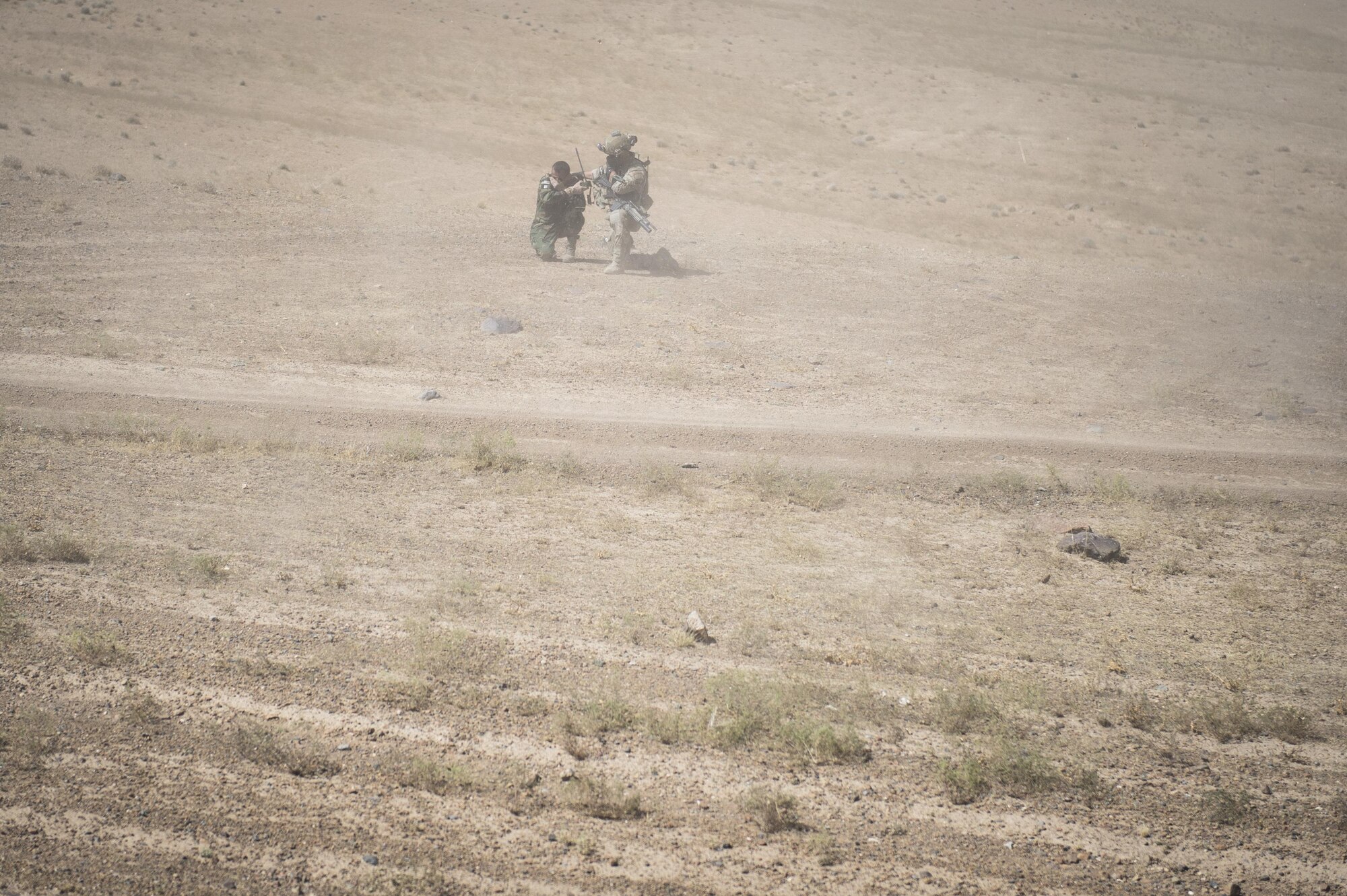 An Afghan Air Force pilot awaits to be recovered by the Airmen from the 83rd Expeditionary Rescue Squadron, during a training mission near Kabul, Afghanistan, Sept. 6, 2016.Airmen from the 83rd ERQS, provided personnel recovery scenario training to the Afghan Air Force's A-29 pilots.
(U.S. Air Force photo/Tech. Sgt. Larry E. Reid Jr., Released)