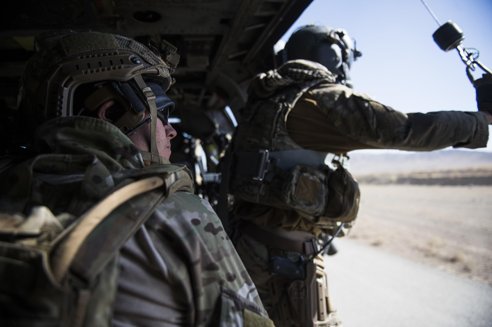 Senior Airman Ty Hatcher, a pararescueman assigned to the 83rd Expeditionary Rescue Squadron, looks on after hoisting an Afghan Air Force pilot into a HH-60 Pave Hawk during a training mission near Kabul, Afghanistan, Sept. 6, 2016. Airmen from the 83rd ERQS, provided personnel recovery scenario training to the Afghan Air Force's A-29 pilots.
(U.S. Air Force photo/Tech. Sgt. Larry E. Reid Jr., Released)