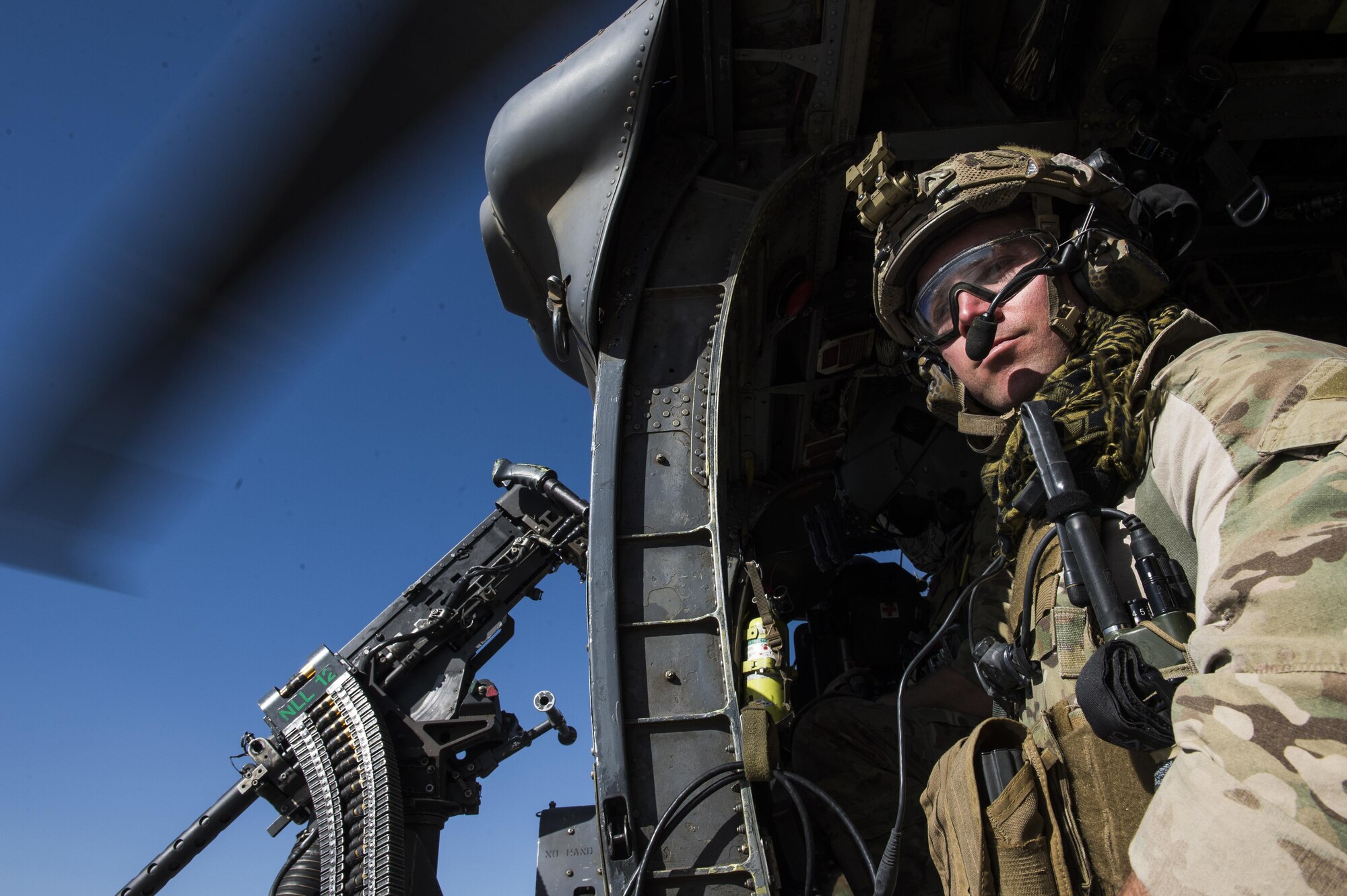 Senior Airman Bradley Menefee, a pararescueman assigned to the 83rd Expeditionary Rescue Squadron, scans his area during a training mission near Kabul, Afghanistan, Sept. 6, 2016. Airmen from the 83rd ERQS, provided personnel recovery scenario training to the Afghan Air Force's A-29 pilots.
(U.S. Air Force photo/Tech. Sgt. Larry E. Reid Jr., Released)