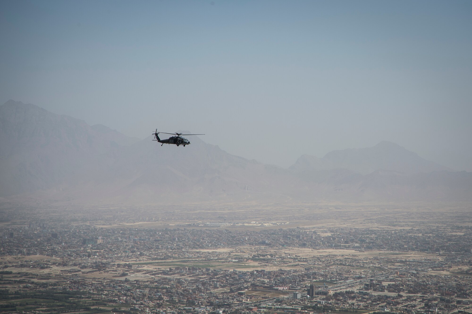 An HH-60G Pave Hawk assigned to the 83rd Expeditionary Rescue Squadron, flies over the city of Kabul, Afghanistan during a training mission, Sept. 6, 2016. Airmen from the 83rd ERQS, provided personnel recovery scenario training to the Afghan Air Force's A-29 pilots.
(U.S. Air Force photo/Tech. Sgt. Larry E. Reid Jr., Released)