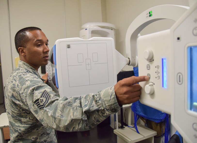 Tech. Sgt. Kristoffer Bruce, 379th Expeditionary Expeditionary Medical Operations Squadron biomedical equipment repair technician, pushes buttons on on an x-ray machine to ensure they machine functions  Sept. 8, 2016, Al Udeid Air Base, Qatar. The native of Fayetteville, N.C., repairs biomedical equipment like it was going to be used to care for his family.  (U.S. Air Force photo/Tech. Sgt. CarlosJ. Treviño/Released)