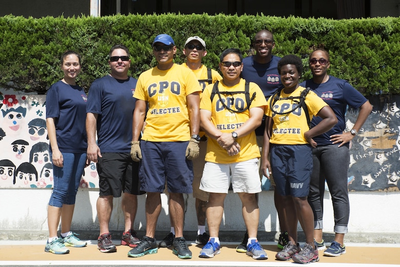 U.S. Navy Seabees of Marine Corps Air Station Iwakuni pose for a photo after volunteering at Ekimae Hoikuen preschool in Iwakuni, Japan, Sept. 8, 2016. The Seabees volunteered with the Marine Memorial Chapel in a project to assist the school in completing required maintenance during an ongoing community relations project. (U.S. Marine Corps photo by Lance Cpl. Joseph Abrego)