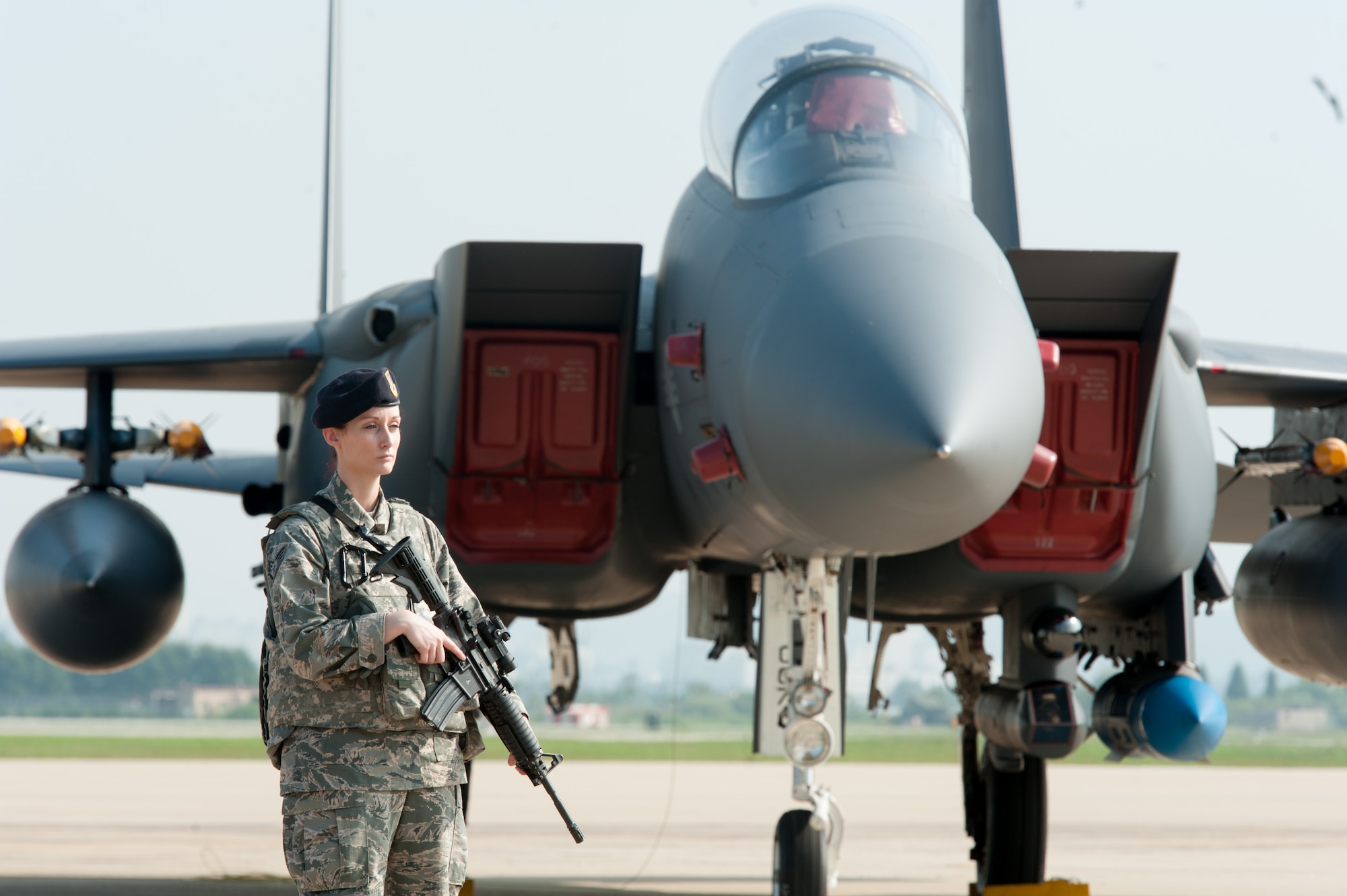 U.S. Air Force Staff Sgt. Paige Dowling, Minneapolis St. Paul Air Reserve Station 934th Security Forces Squadron member, provides security for static display during a press conference following a flyover in response to recent provocative action by North Korea, Sept. 13, 2016, at Osan Air Base, ROK. Two U.S. Air Force B-1B Lancers from Andersen Air Force Base, Guam, were joined by Republic of Korean F-15K Slam Eagles and U.S. Air Force F-16 Fighting Falcons during the flyover. The close military cooperation between the U.S. and ROK keeps us ready to respond at any time to those who would threaten stability and security. (U.S. Air Force photo by Staff Sgt. Jonathan Steffen)