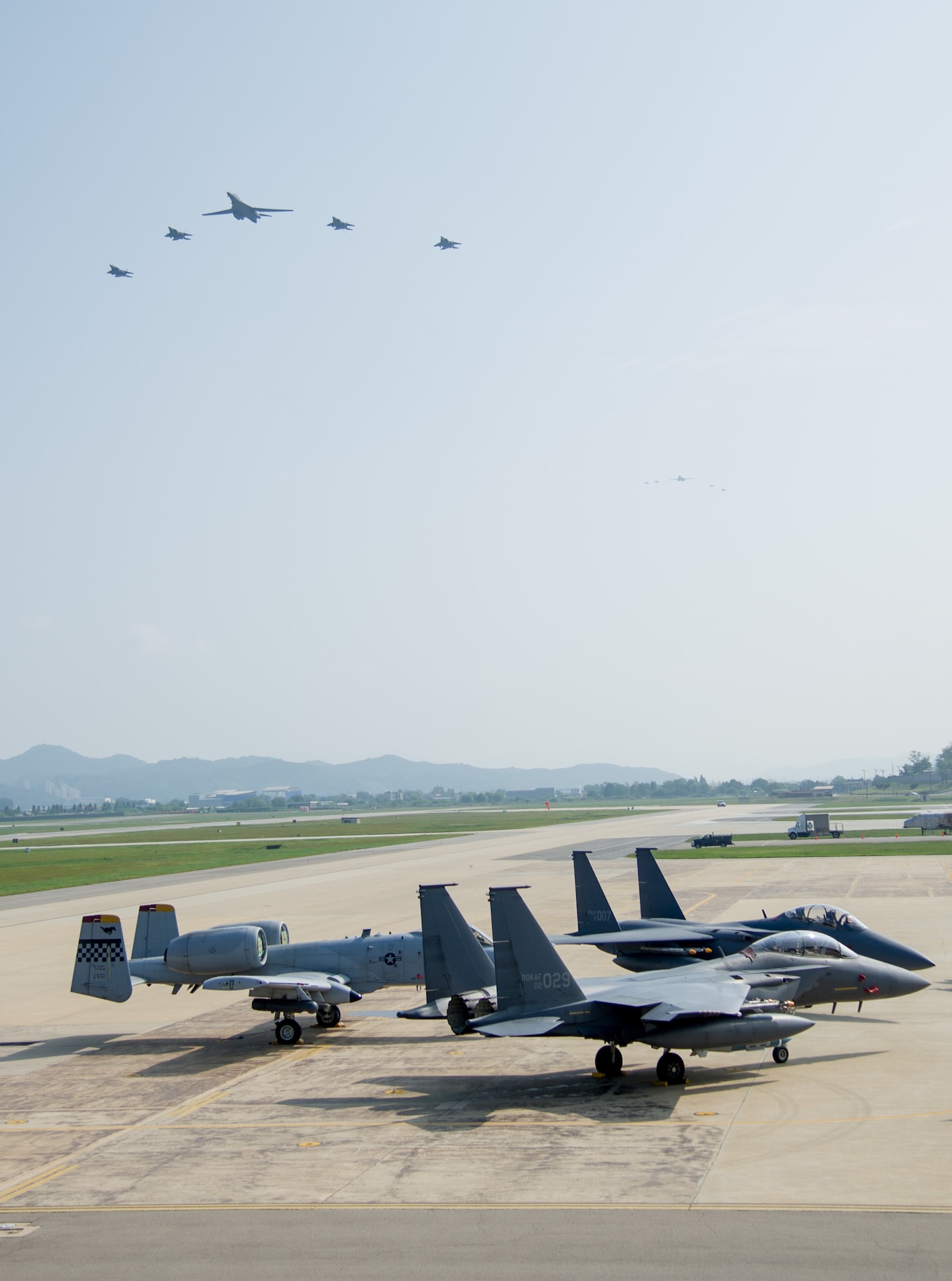 U.S. Air Force B-1B Lancers assigned to Andersen Air Base, Guam, perform a flyover over Osan Air Base, Republic of Korea, Sept. 13, 2016. The B-1 is the backbone of the U.S. long-range bomber mission and is capable of carrying the largest payload of both guided and unguided weapons in the Air Force inventory. The flyover was performed in response to provocative actions taken by North Korea. (U.S. Air Force photo by SSgt Jonathan Steffen)