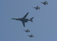 U.S. Air Force F-16 Fighting Falcons assigned to the 36th Fighter Squadron escort a U.S. Air Force B-1B Lancer from Andersen Air Force Base, Guam, during a flyover over Osan Air Base, Republic of Korea, Sept. 13, 2016. The B-1 is capable of rapidly delivering massive quantities of precision and non-precision weapons against any adversary, anywhere in the world, at any time. (U.S. Air Force photo by Victor J. Caputo)