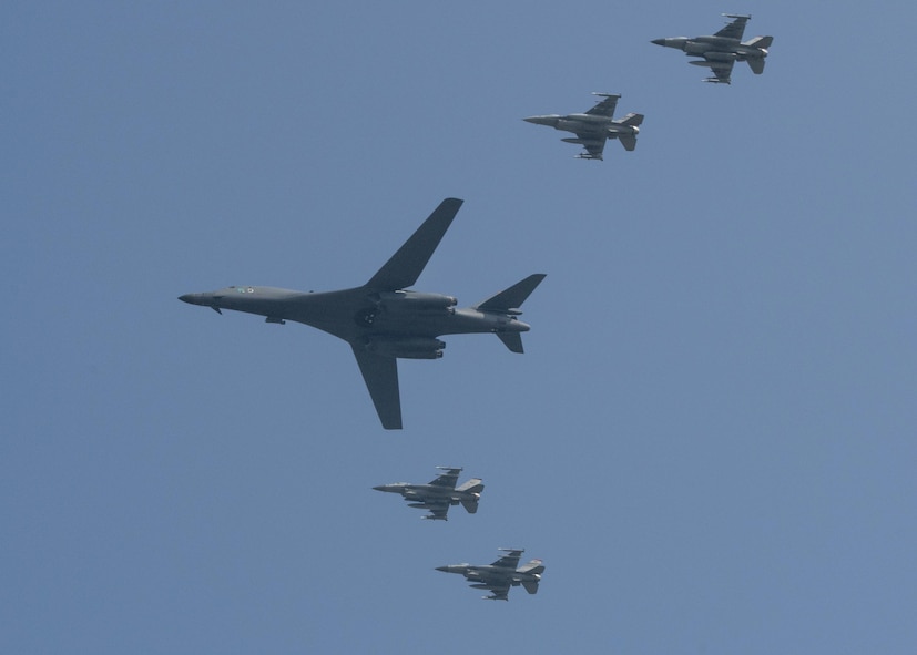 U.S. Air Force F-16 Fighting Falcons assigned to the 36th Fighter Squadron escort a U.S. Air Force B-1B Lancer from Andersen Air Force Base, Guam, during a flyover over Osan Air Base, Republic of Korea, Sept. 13, 2016. The B-1 is capable of rapidly delivering massive quantities of precision and non-precision weapons against any adversary, anywhere in the world, at any time. (U.S. Air Force photo by Victor J. Caputo)