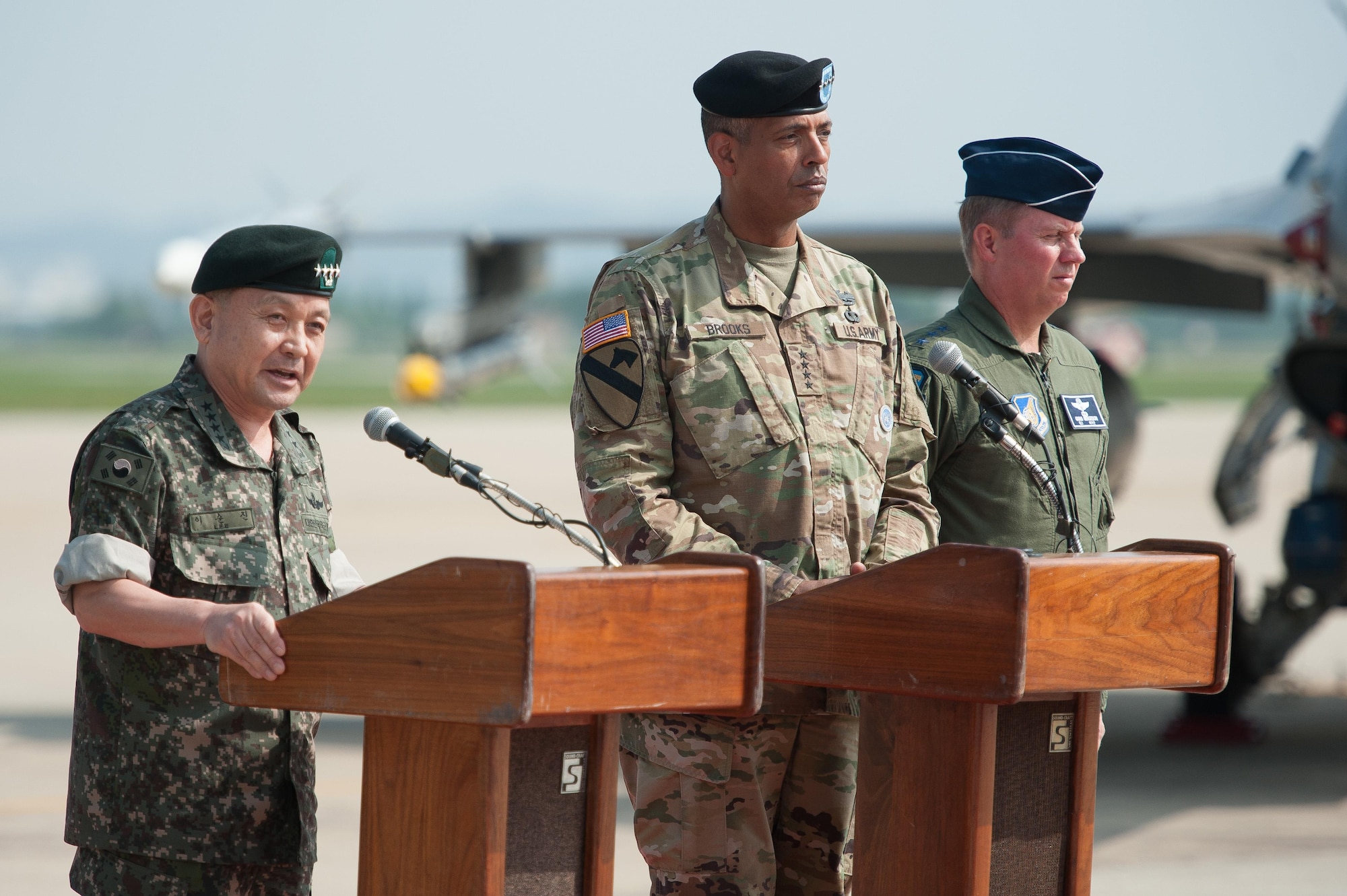 Republic of Korea army Gen. Lee, Sun Jin, Chairman of the Republic of Korea Joint Chiefs of Staff, joined by U.S. Army Gen. Vincent K. Brooks, U.S. Forces Korea commander, and U.S. Air Force Lt. Gen. Thomas Bergeson, 7th Air Forces commander, speaks during a press conference following a flyover in response to recent provocative action by North Korea, Sept. 13, 2016, at Osan Air Base, ROK. Two U.S. Air Force B-1B Lancers from Andersen Air Force Base, Guam, were joined by Republic of Korean F-15K Slam Eagles and U.S. Air Force F-16 Fighting Falcons during the flyover. The close military cooperation between the U.S. and ROK keeps us ready to respond at any time to those who would threaten stability and security. (U.S. Air Force photo by Staff Sgt. Jonathan Steffen)
