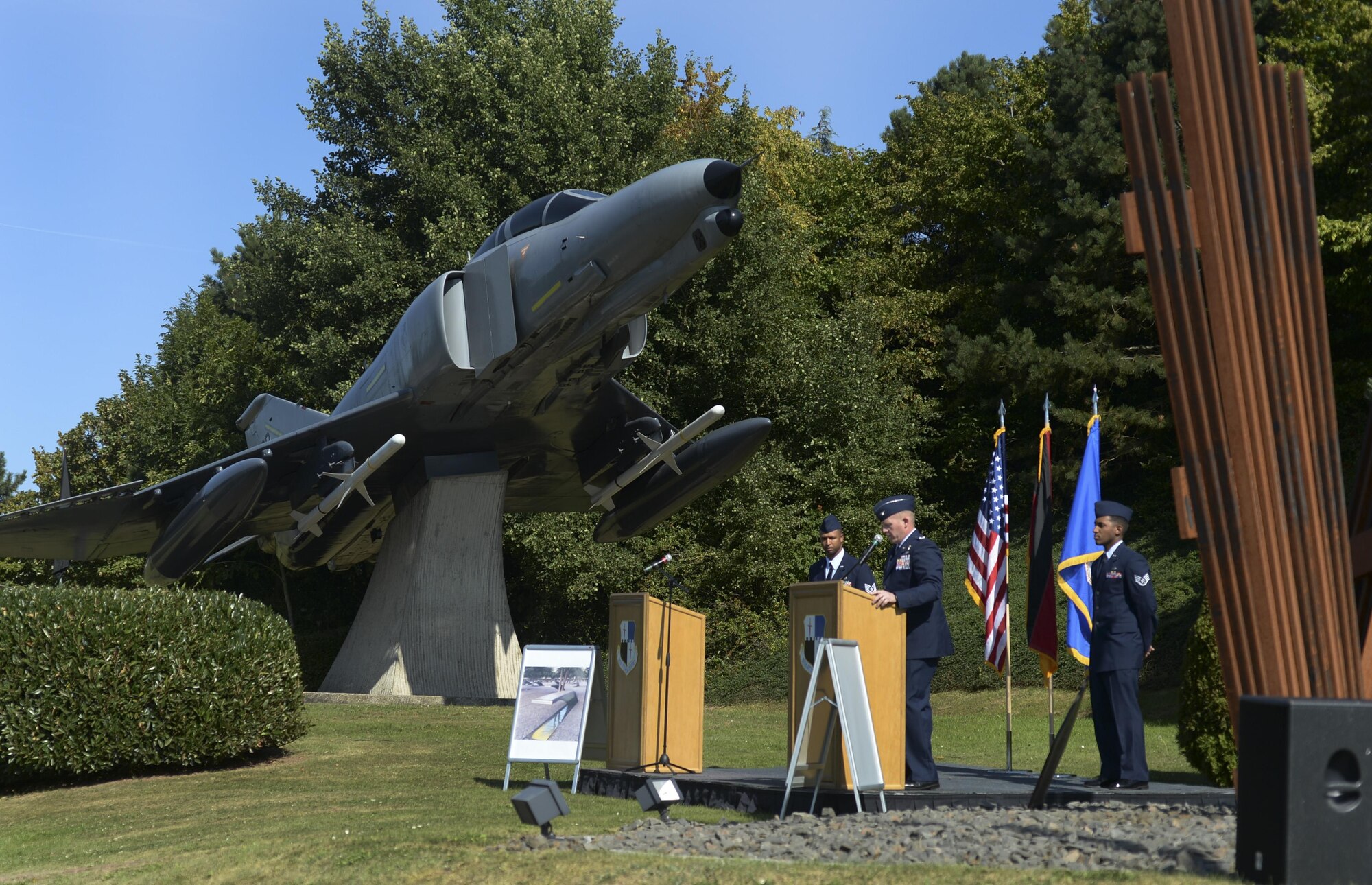Col. Joe McFall, 52nd Fighter Wing commander, recites a first-person narrative of the events of Sept. 11, 2001 during a memorial service at Spangdahlem Air Base, Germany, Sept. 9, 2016. Airmen throughout the Air Force held memorial ceremonies honor the victims, lost service members and emergency response teams as part of the 15th anniversary of the attacks. (U.S. Air Force photo/Senior Airman Dawn M. Weber)